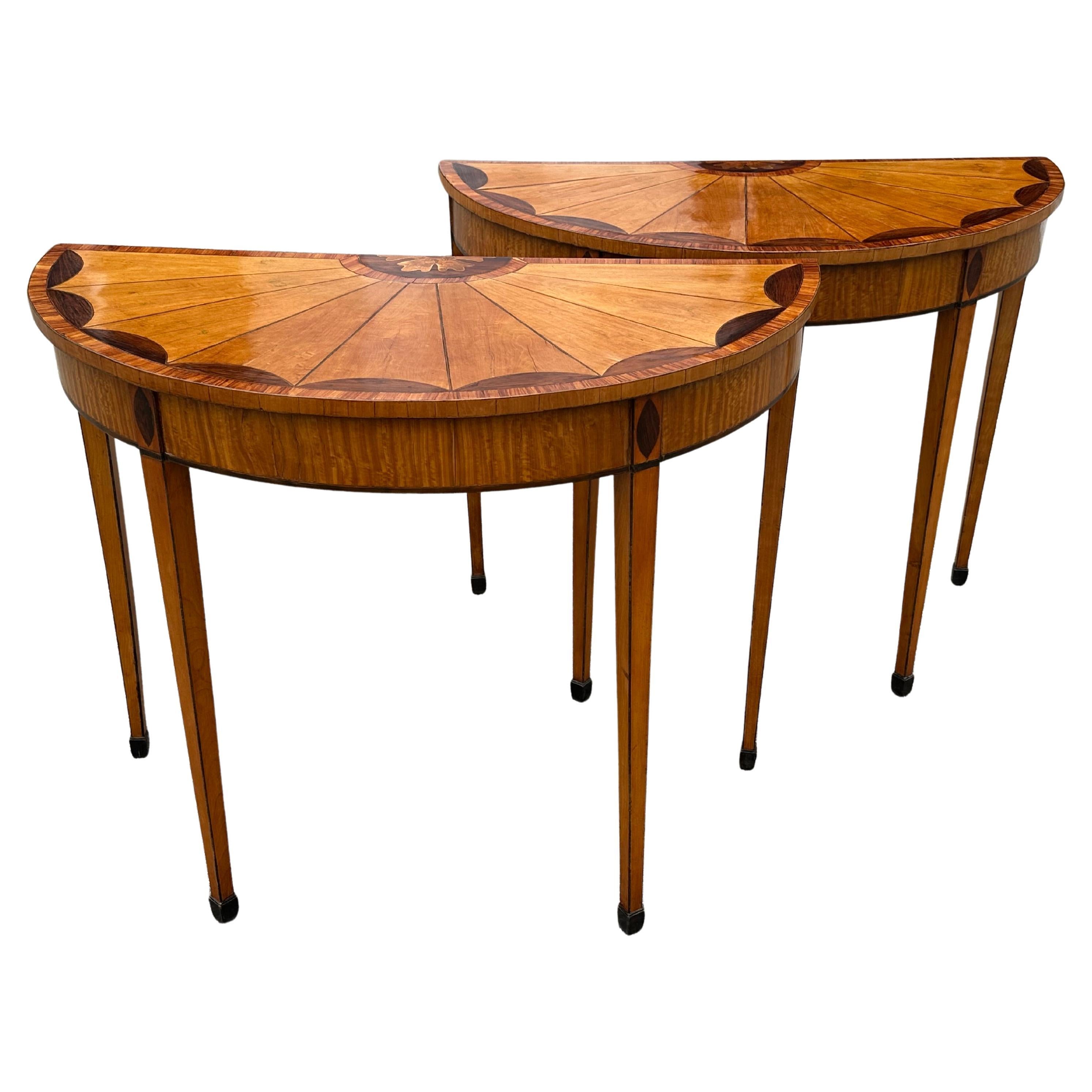 Fine Pair of 19th Century George III Style or Adam Demi-lune Tables.  Beautifully veneered in satinwood.  Neoclassical fan motif.  

Provenance: Kennebunkport Family of Note