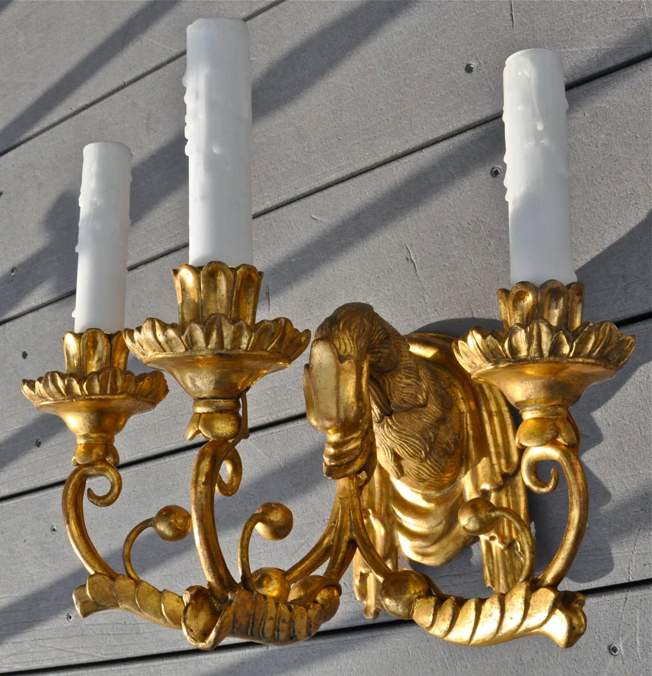 Set of four original giltwood neoclassical sconces.
Original gilding.
Carved and draped swan form issuing three candle arms from beak.
Great condition.
Newly wired.