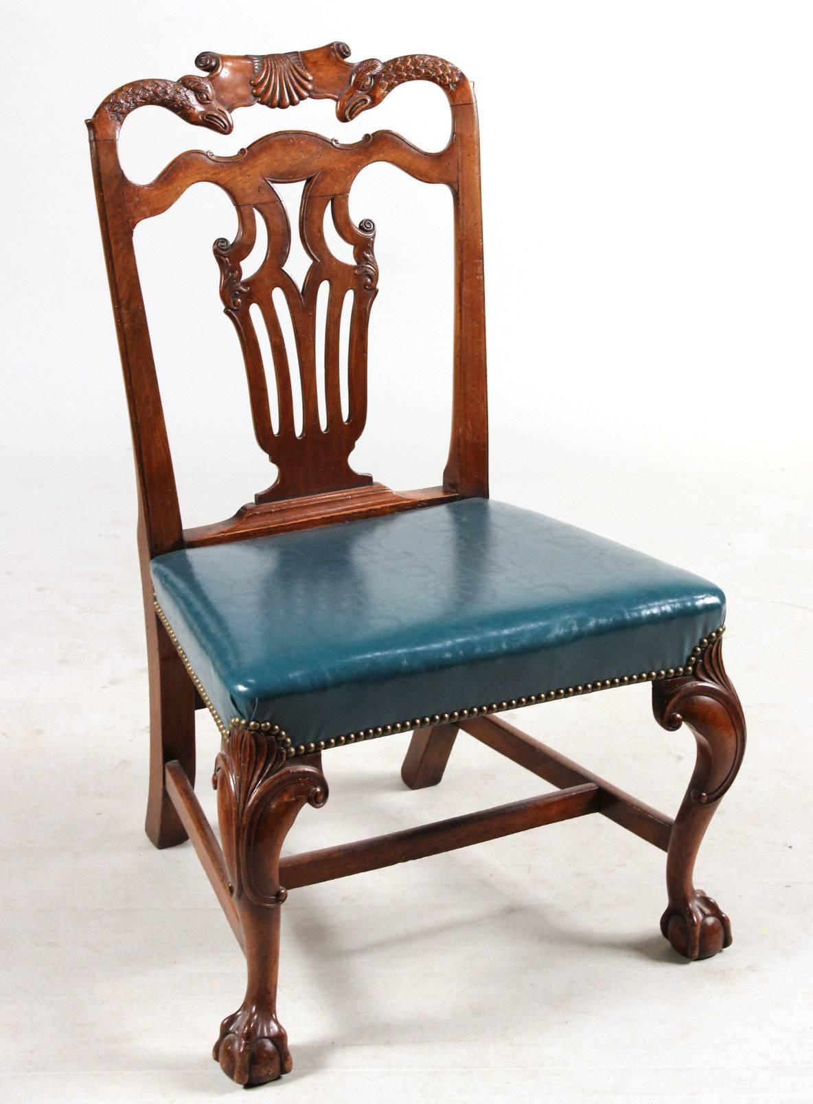 19th century irish Georgian dining chairs.

Two arms and eight sides.
Mortise and tenon throughout.
Carved Eagle back rests and Eagle armrests.
Ball and claw feet.
 