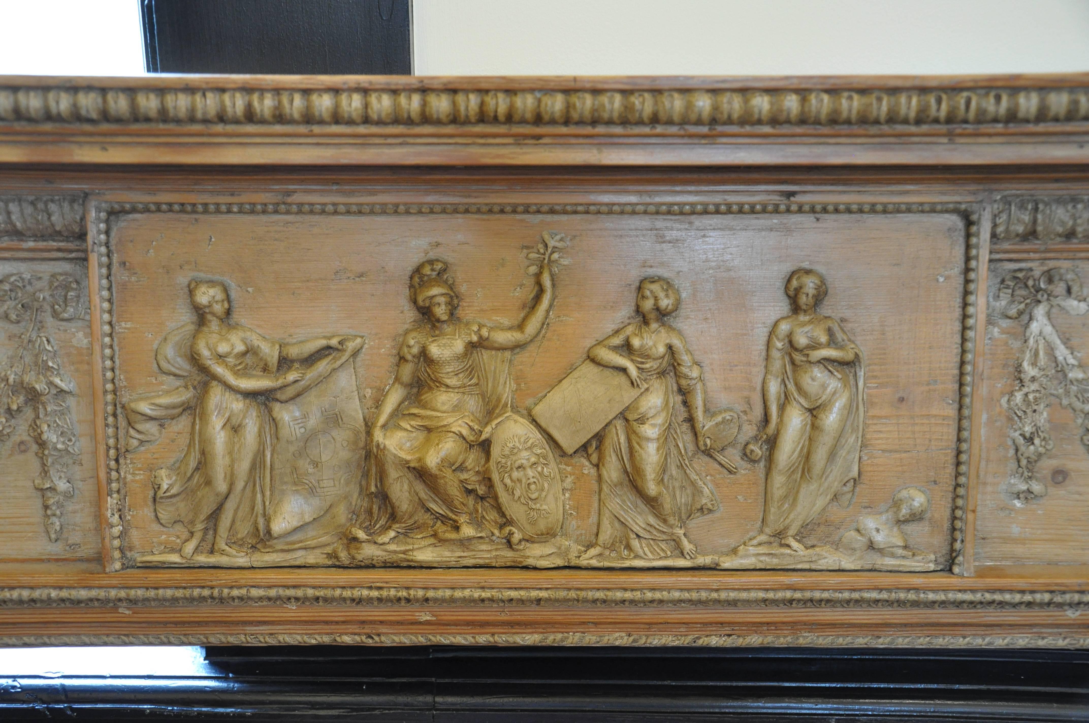 Period Irish influenced pine and gesso mantel or chimney piece.

Pine with neoclassical gessoed reliefs.
Allegorical figures: Minerva and the Muses, representing 