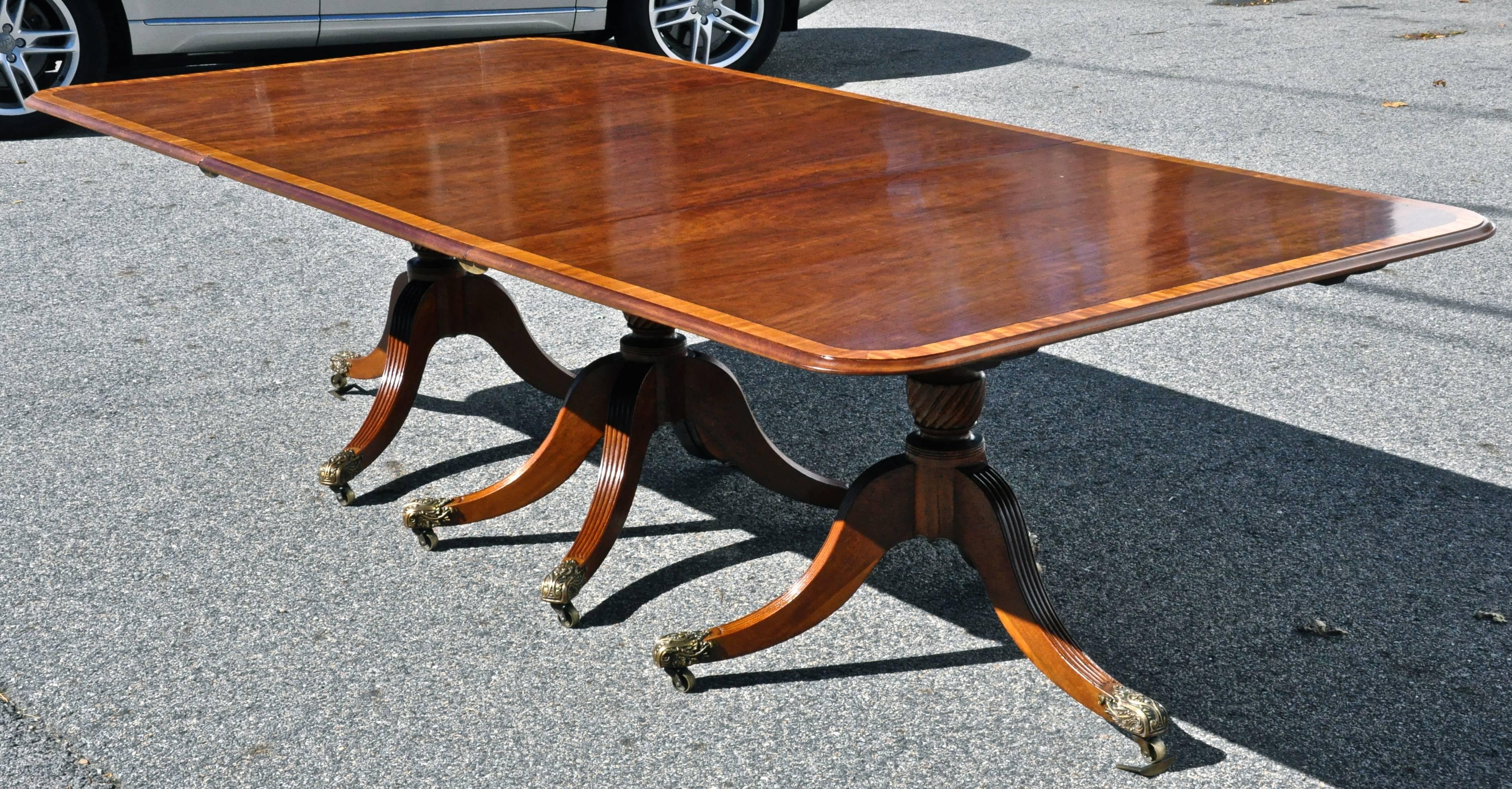 Solid mahogany Regency style or William IV triple pedestal dining table.

