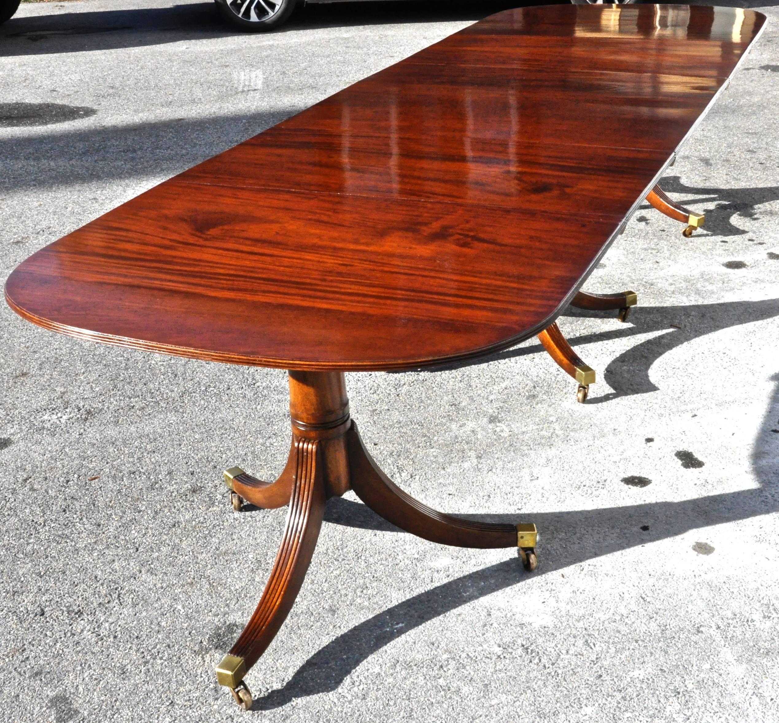 Mid-19th century mahogany three-pedestal dining table.

Bookmatched original Cuban mahogany.
Nice figuring.
Leaves original to table.
Three sections and two leaves.

Dimensions: 138