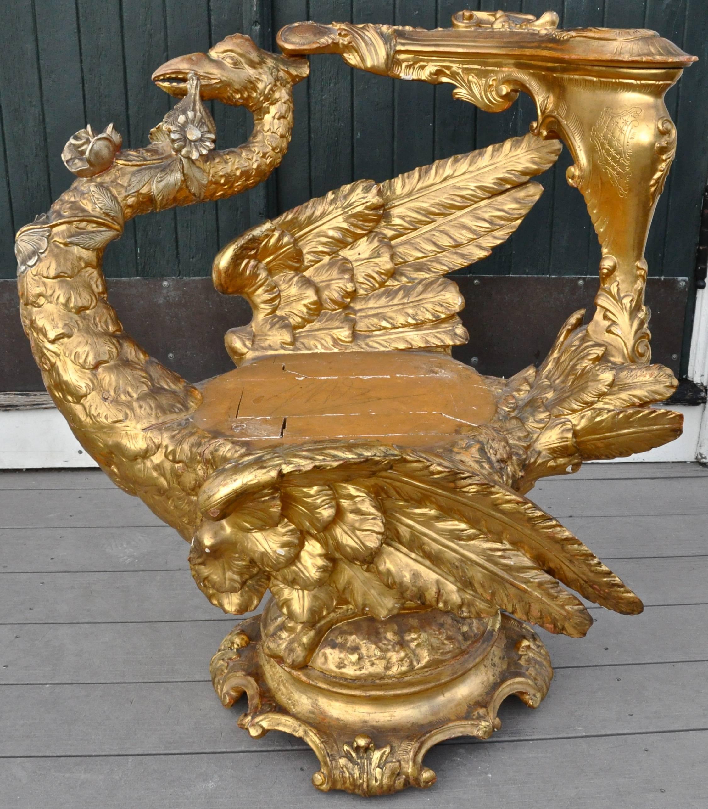 Rare and complete 19th century carved and gilt Venetian swan Grotto chair.

Realistically and exquisitely carved swan. Carved on all sides. Feathers showing plumage. Armrest in Rococo C-Scroll. Swan sitting on Rococo base.
Retains its original
