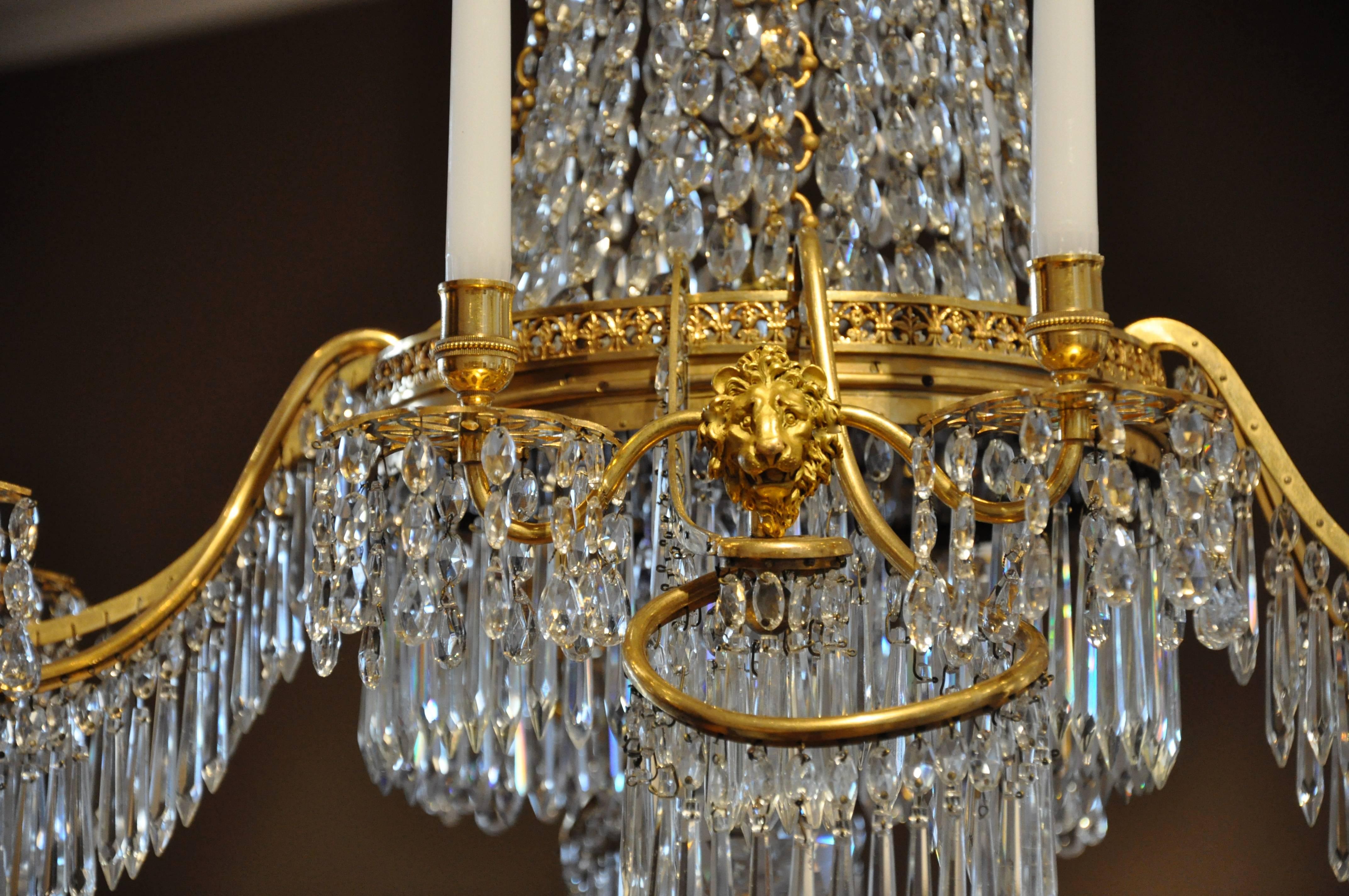 Period German neoclassical chandelier in gilt bonze with original crystals and cobalt glass plate.  Manufacturer Werner and Mieth, Berlin

--Perfect Ormolu, all original.
--issuing eight candle arms
--never has been drilled for
