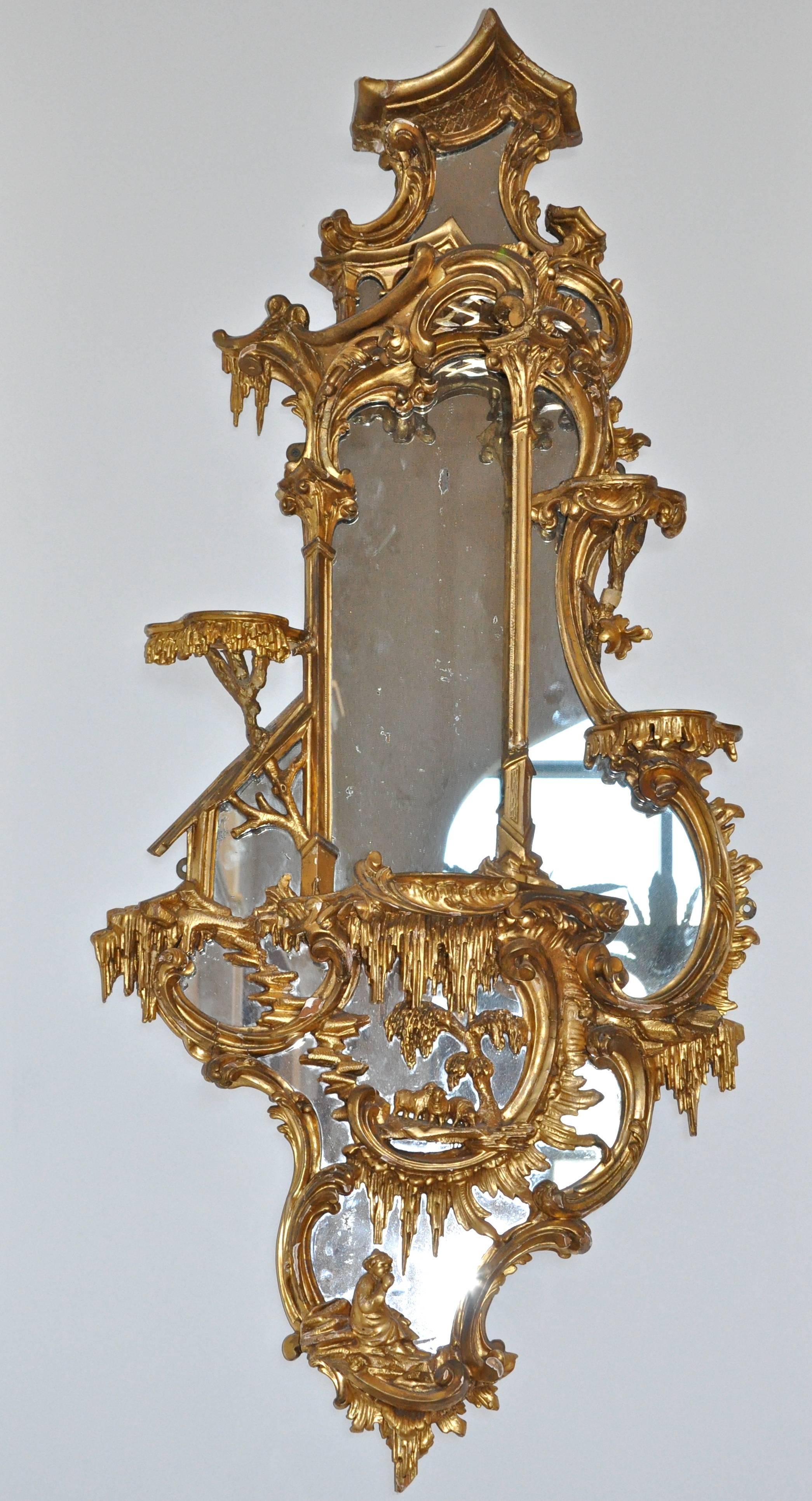 Pair of 18th century George III Gilt Chippendale mirror brackets

Attributed to the Master Carver, Thomas Johnson
Incredible carving of realistic flora and fauna. Seated Shepherdesses with carved lambs, rock cropping, water features and rocaille