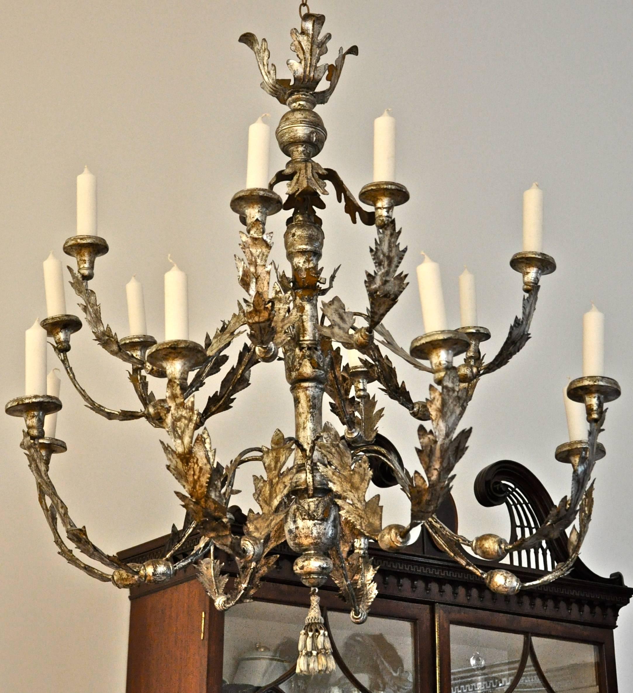 Period 18th century silver gilt chandelier, Italian

16 pricket lights, original iron and tole arms, foliate neoclassical design
Original throughout
Wonderful patina.