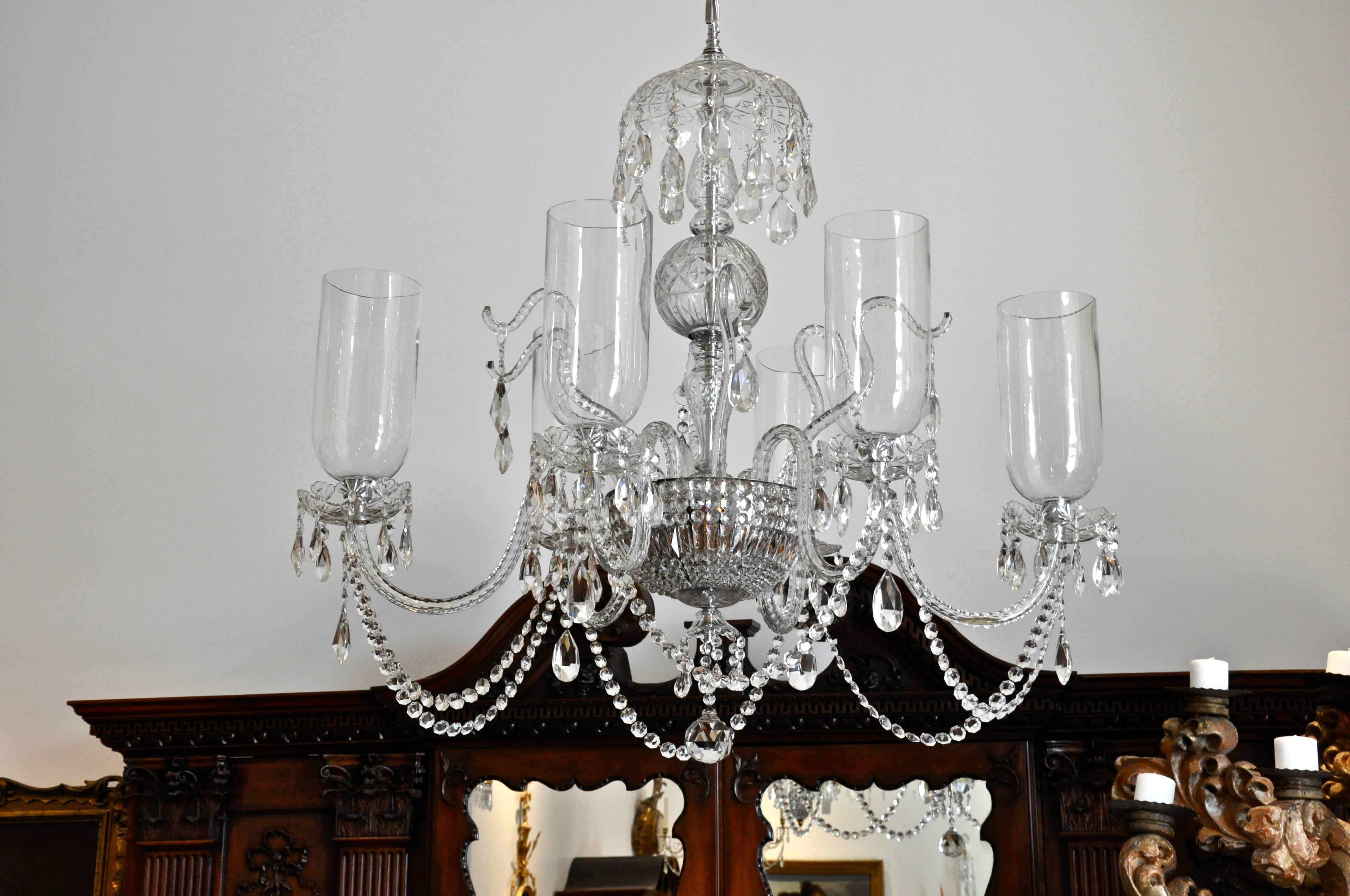 Rare and exquisite pair of Georgian inspired chandeliers of the mid-century modern period

Wonderfully cut crystal
Custom designer created for an exquisite Bedford, New York home in the 1950s
Hollywood Mid-
Century glamour
Original blown glass