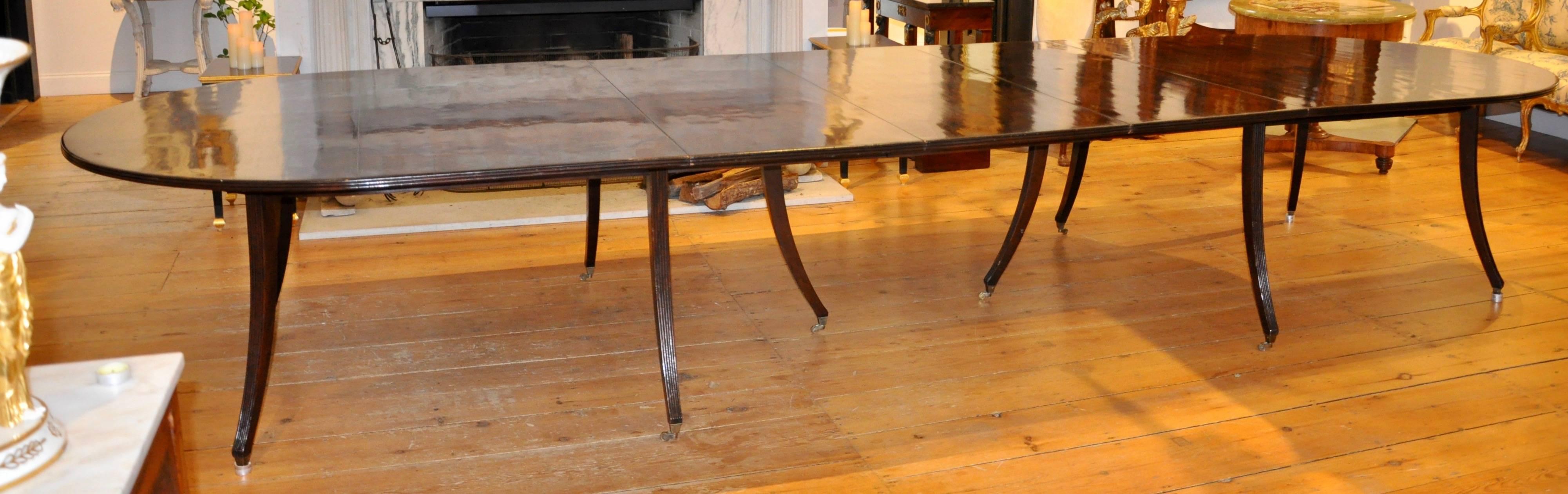 Custom Commissioned Mid-Century Style Dining Table in Mahogany

--Reeded Splay Legs
--Rich Mahogany Choice
--In Regency Period Inspiration
--Works in Modern as Well as Traditional
--Has Three Leaves
--maximum length is 195