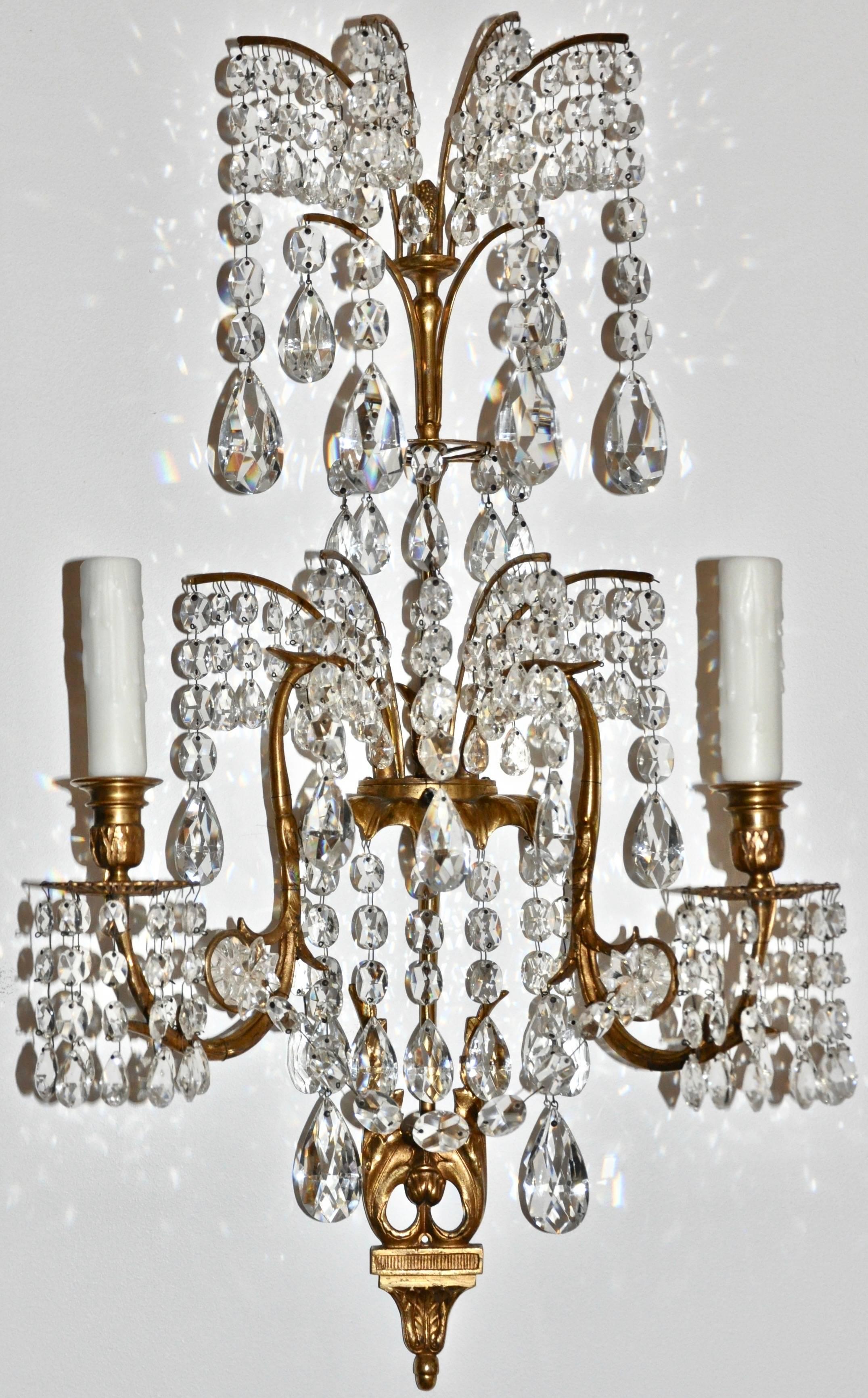 Set of four gilt bronze and crystal sconces in the manner of Karl Friedrich Schinkel

Neoclassical fountain form with original crystals and original gilding. Two arm. Of German or Russian
Manufacture
French wired and include custom backplates