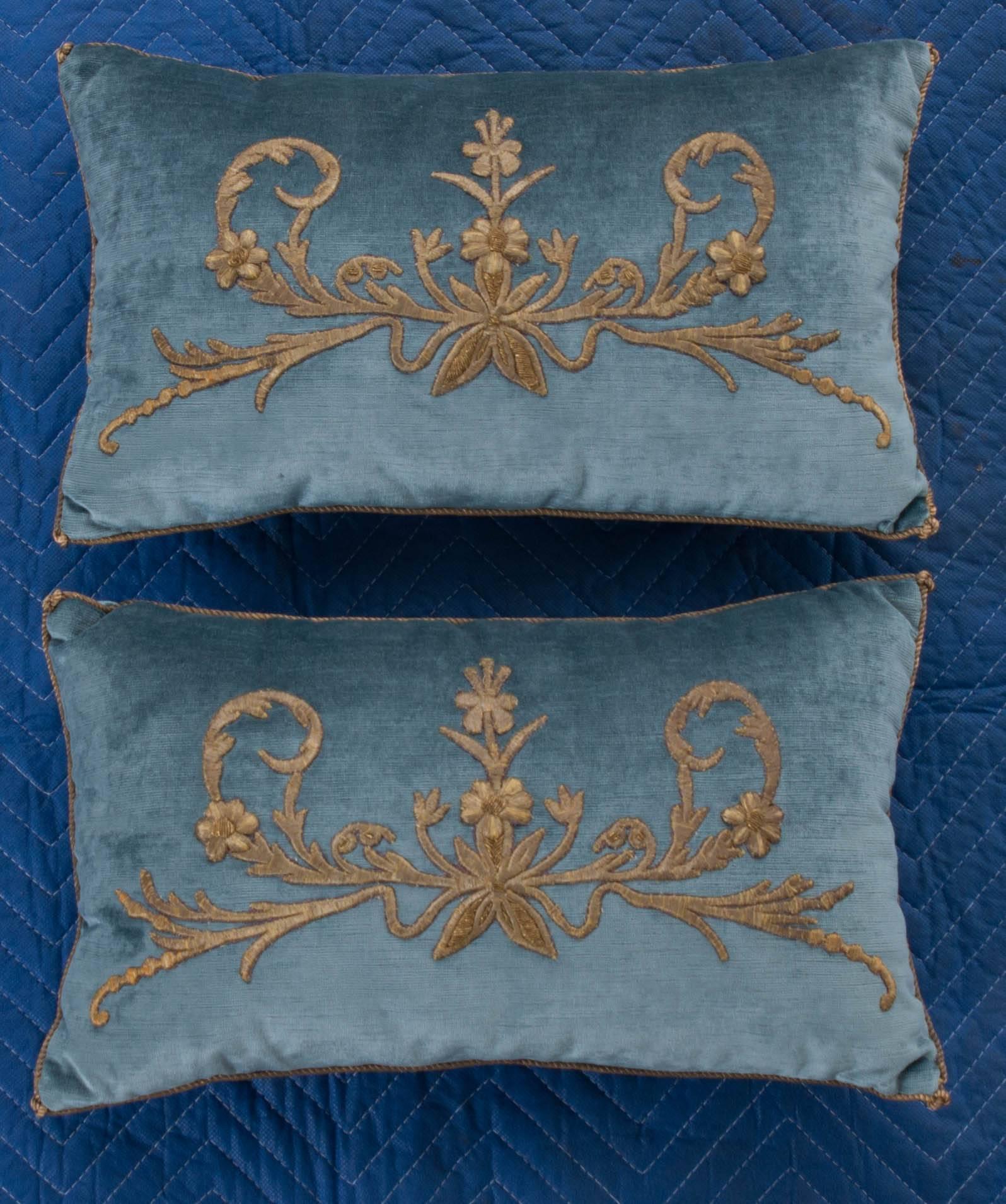 Antique Ottoman Empire raised gold metallic embroidery on wedgewood blue velvet. Hand trimmed with tiny vintage gold metallic cording knotted in the corners. Down filled. Available for individual sale: $1,350.00 each.