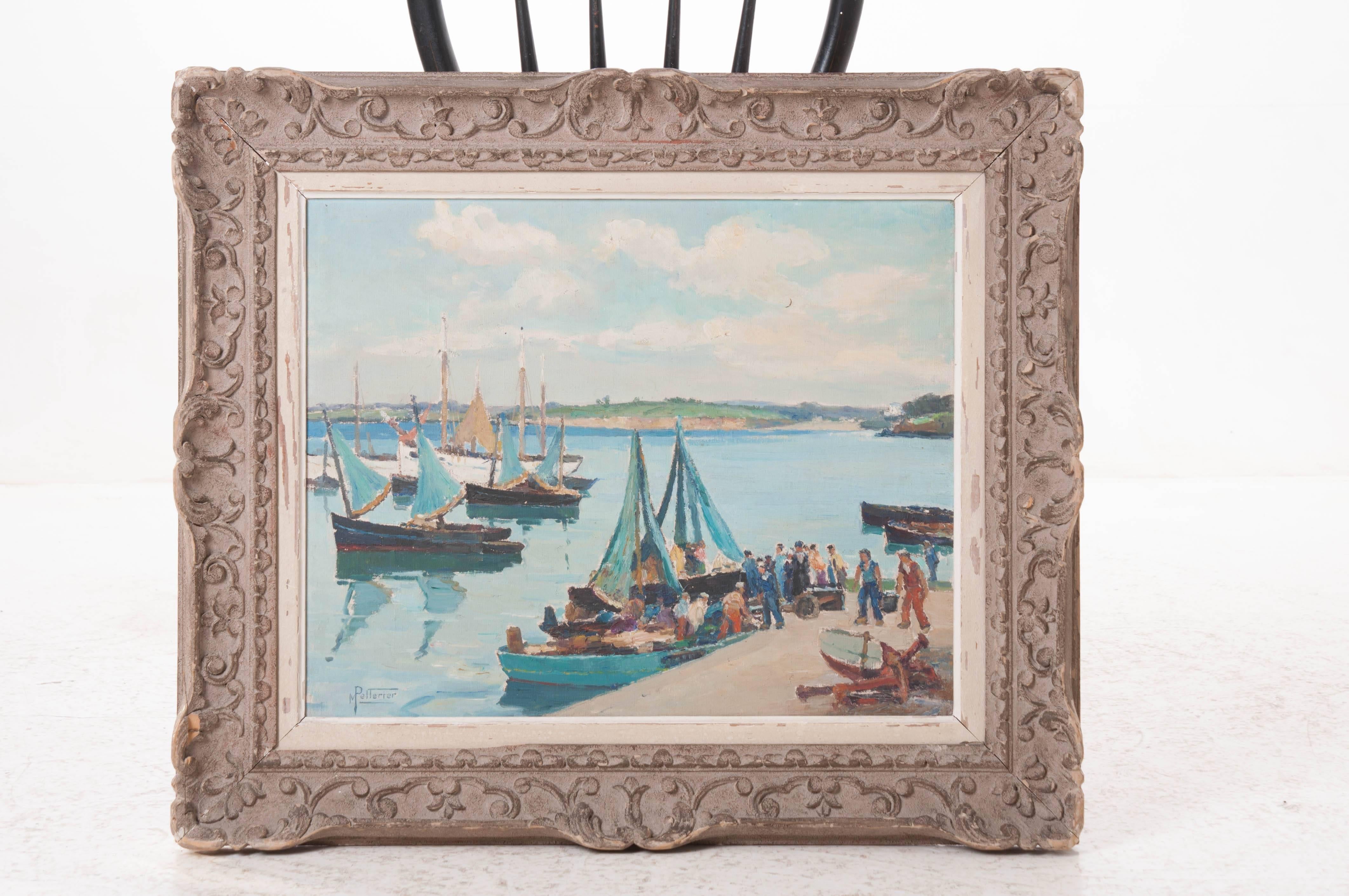 Born January 22, 1875, Maurice Pellerier painted this delightful landscape depicting fishermen in Brittany returning with the day's catch. A heavily carved frame surrounds the piece in a cool, antique gray, circa 1937.