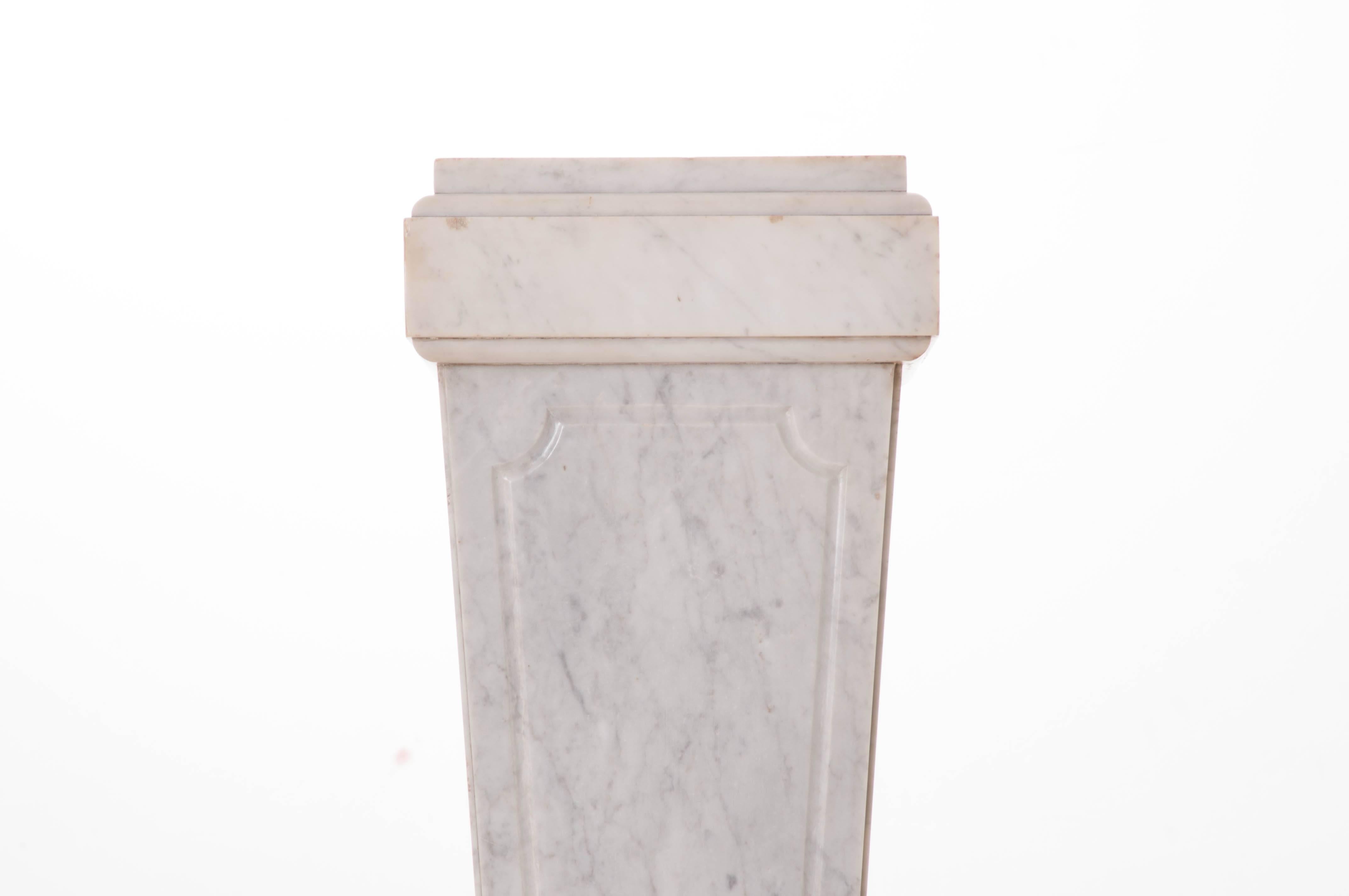 A beautiful white marble pedestal from 19th century, France. This pedestal would be a wonderful stand for a potted plant, artistic sculpture, or for statuary. This marble pedestal's tapered design and Classic style will add an element of