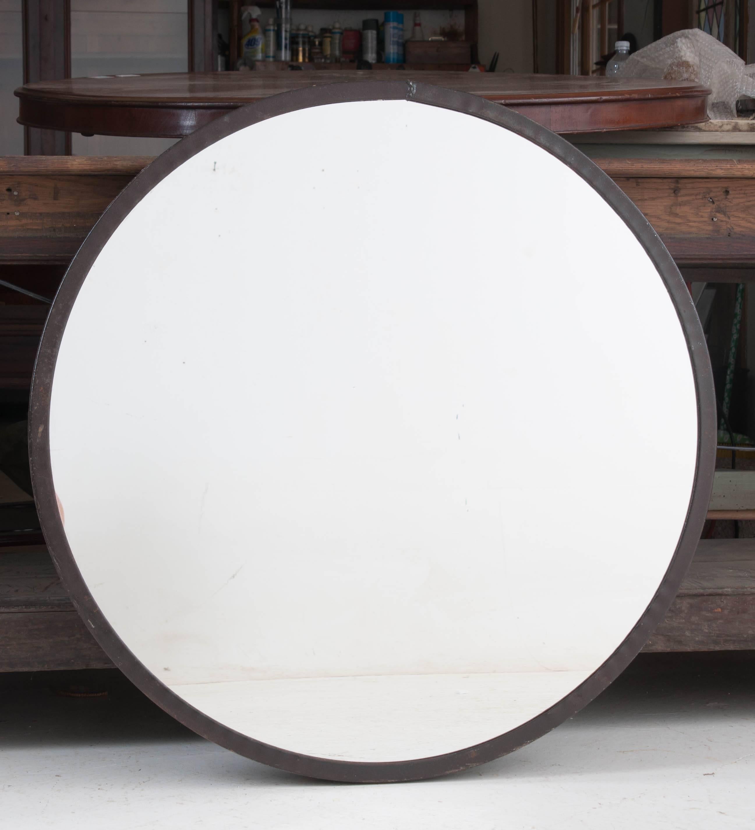 Round mirrors with metal frames are a unique and fun way to add an element of modernity to your space. This mirror has a 35 1/2