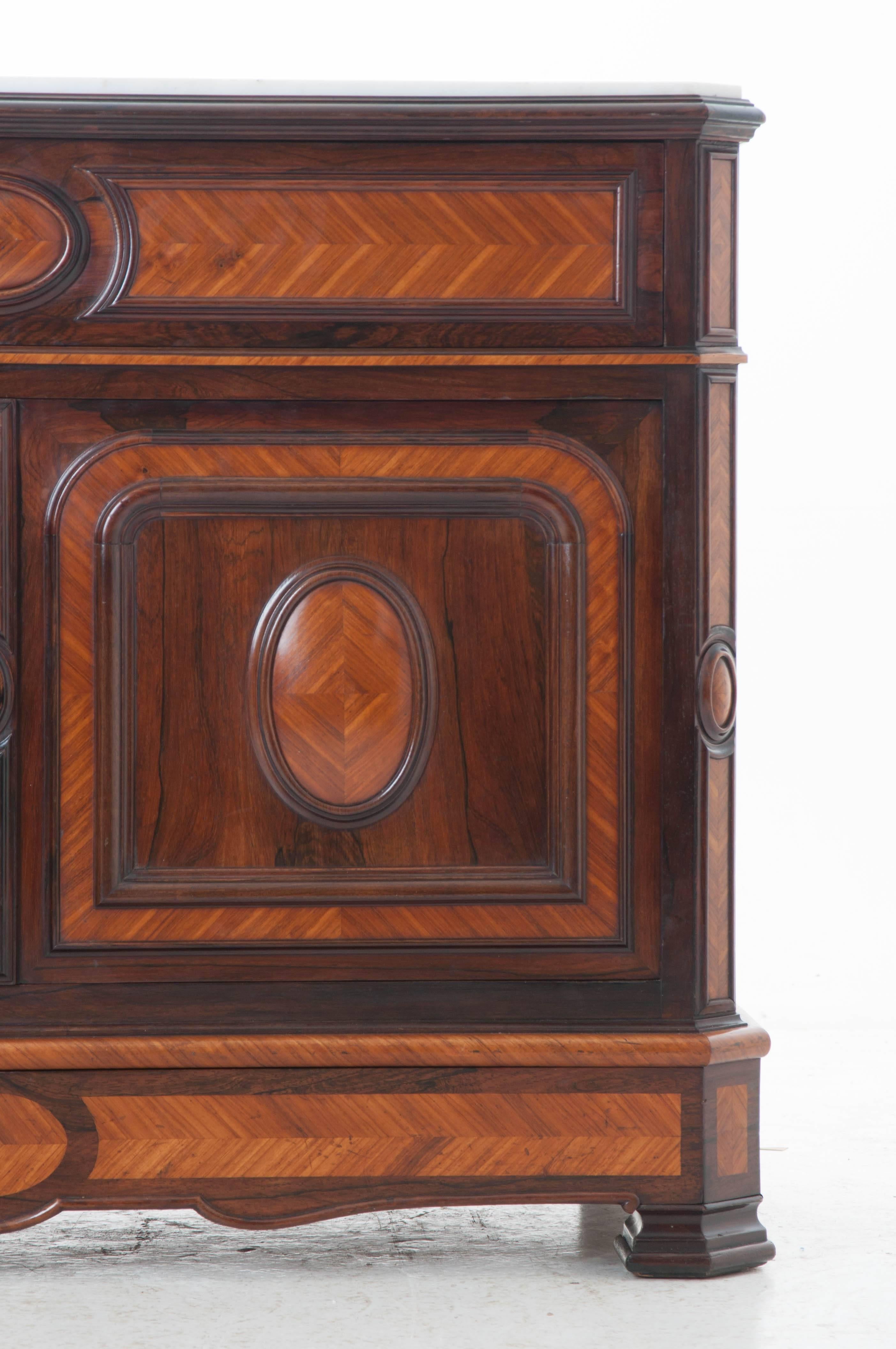 A masterfully inlaid walnut and rosewood drop front desk with marble top from 19th century, France. The white marble top is in great antique condition with canted front corners shaped to fit this piece. This exceptional antique features a drop front