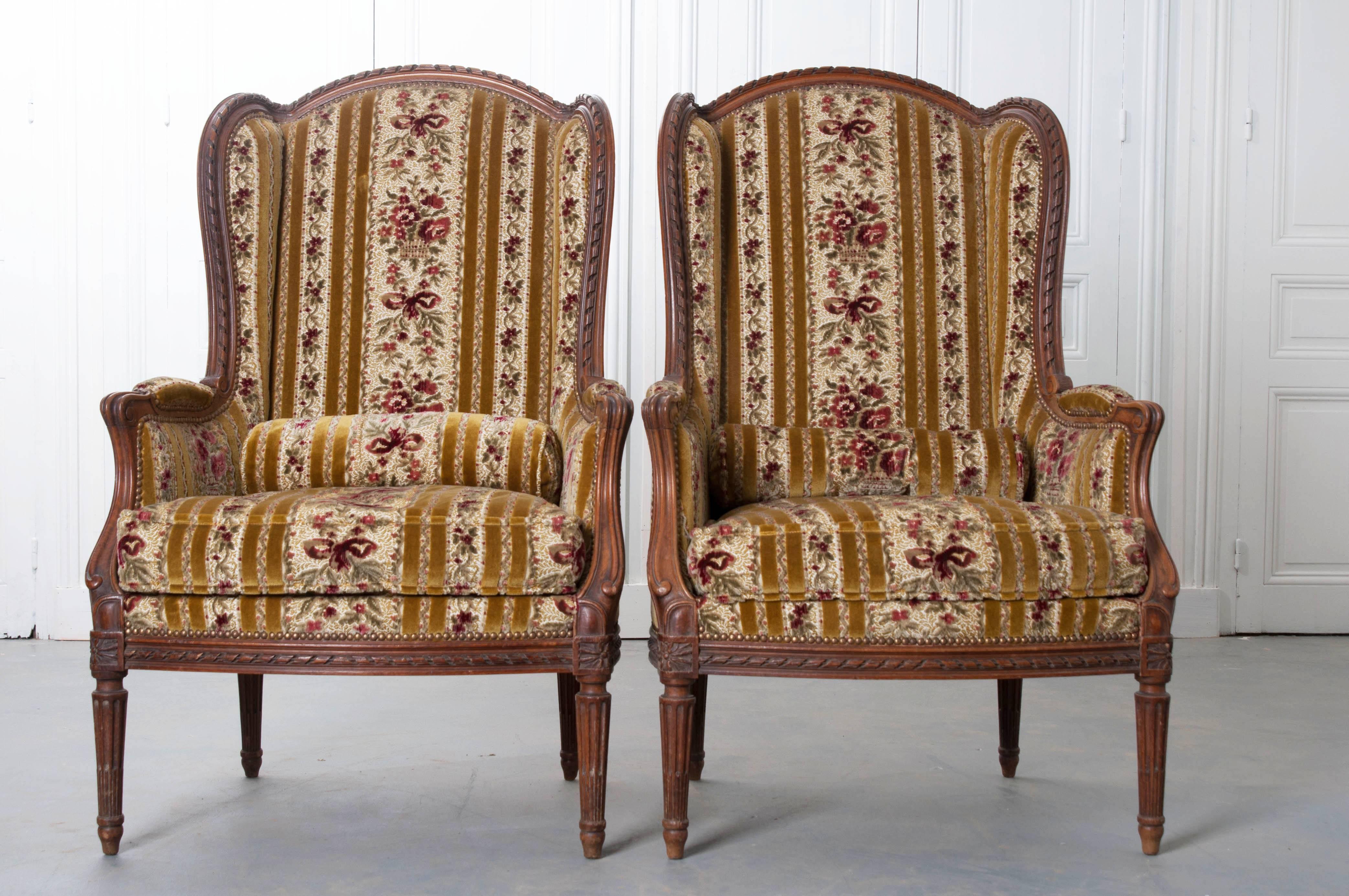Pair of French 19th Century Walnut Transitional Wingback Bergères 1