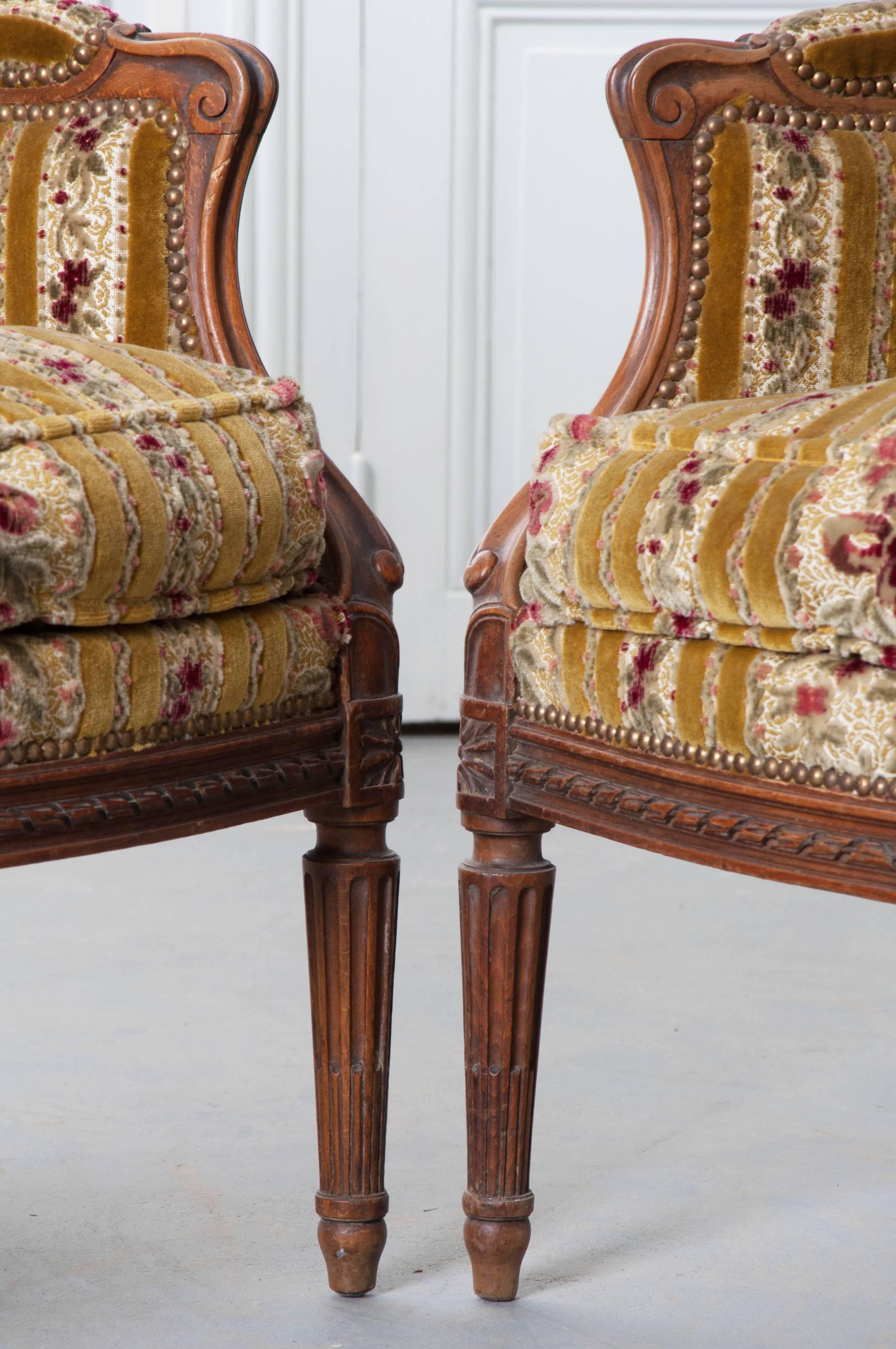 Pair of French 19th Century Walnut Transitional Wingback Bergères 4