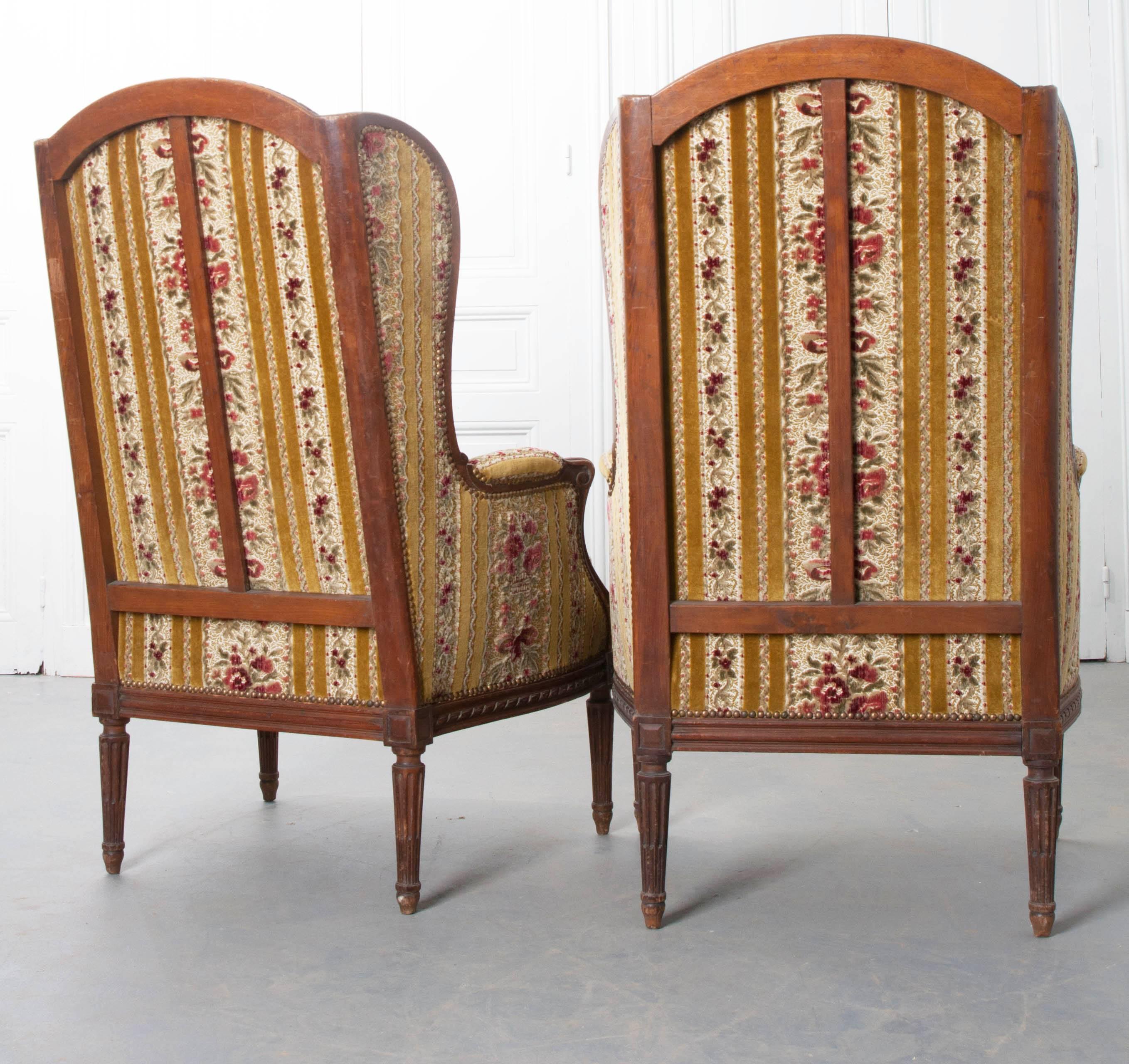 Pair of French 19th Century Walnut Transitional Wingback Bergères 7