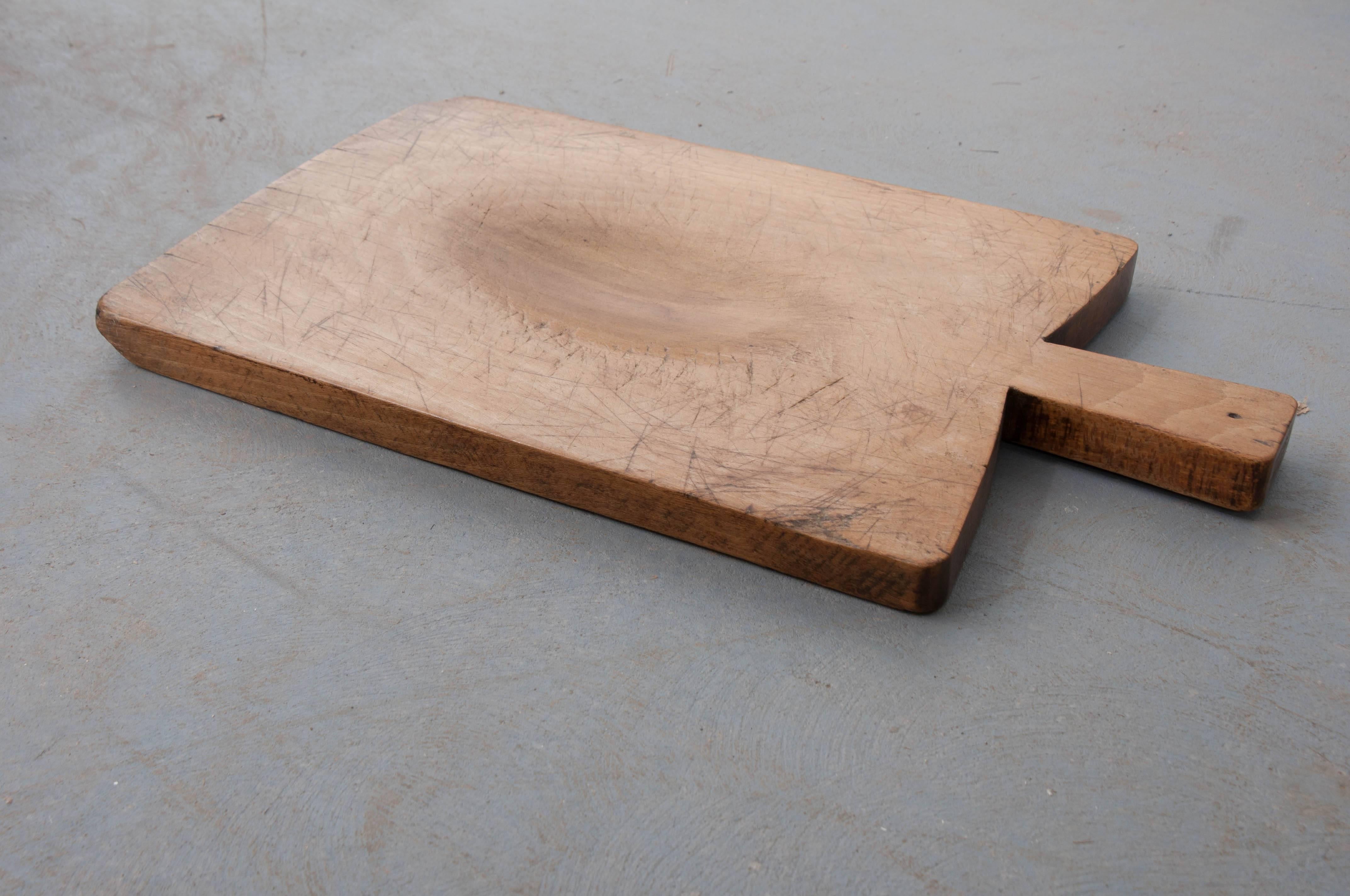An exceptional selection of antique bread boards from 19th century, France. With several to choose from, each board varies from the next. Some boards are more worn than others. Some have deep grooves from decades of use, while others are more flat.