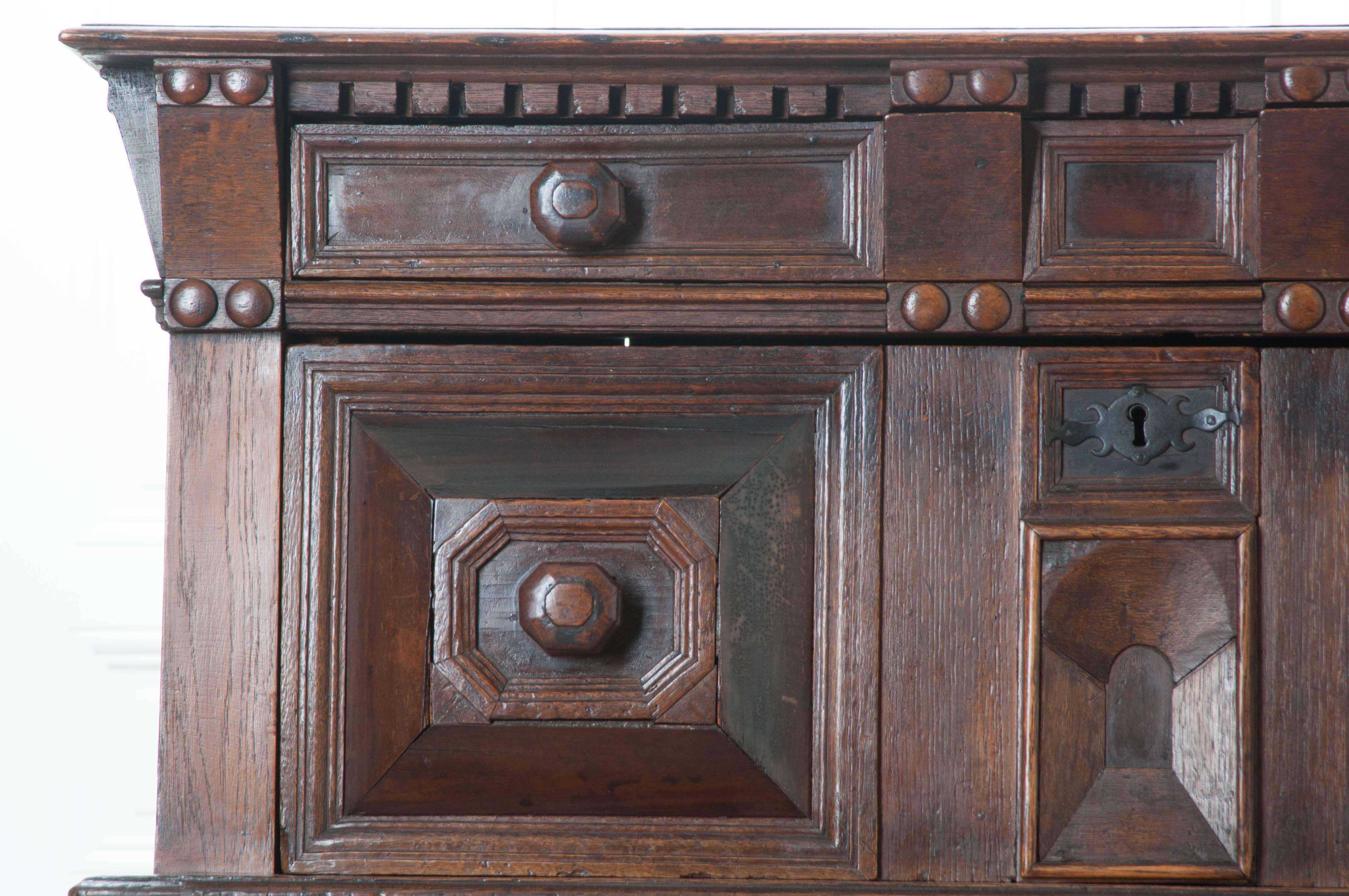 An extraordinary oak chest of drawers from the mid-17th century, England. Remarkable craftsmanship was employed when making this amazing piece. Wonderfully carved details can be found all-over this antique chest. Above the top two drawers are carved