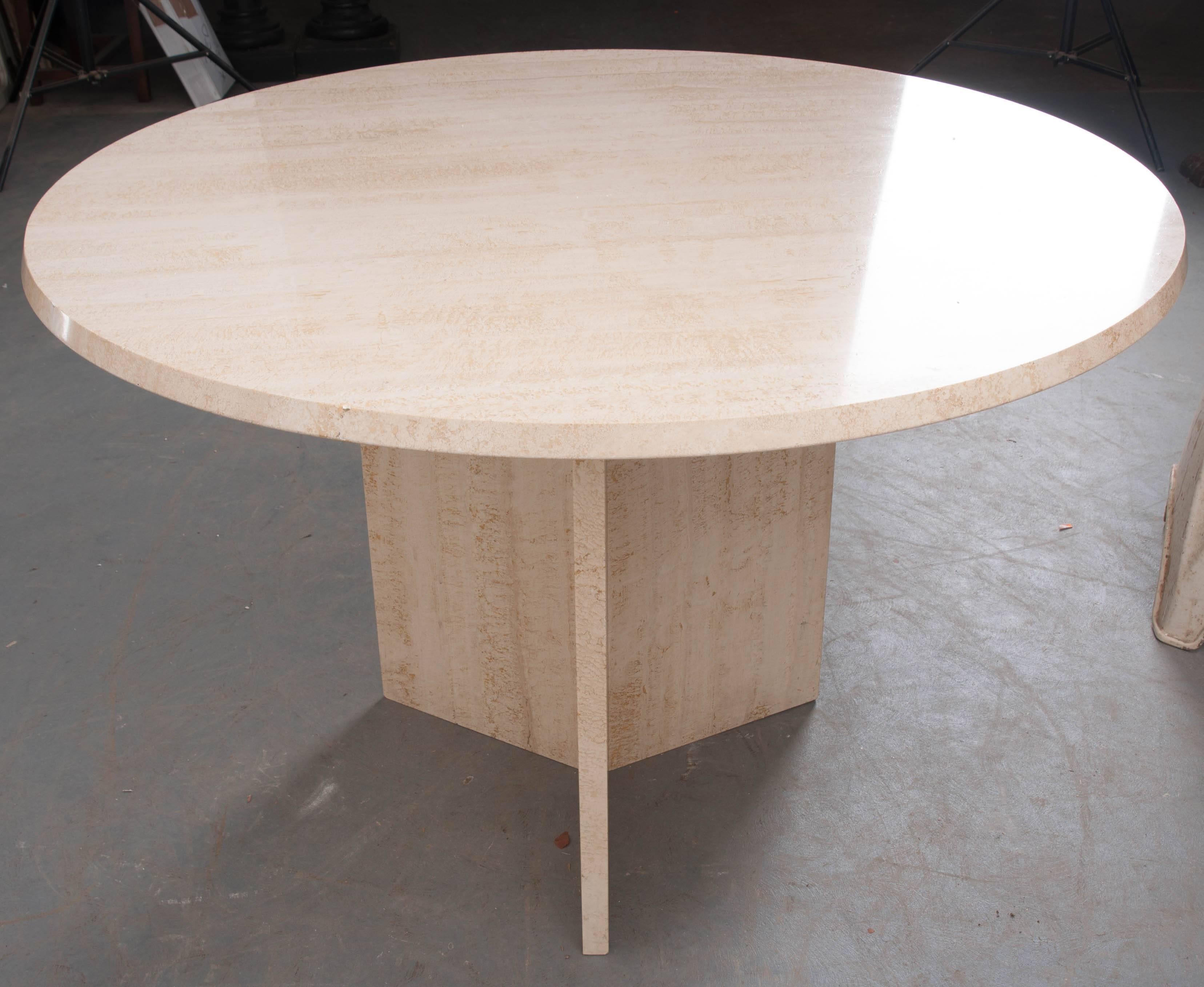 A stunning, round, stone dining table from early 20th century, France. The ivory stone is in exceptional condition and rests perfectly on its three-panel stone pedestal base. This show stopping antique is stylish and chic and sure to impress your