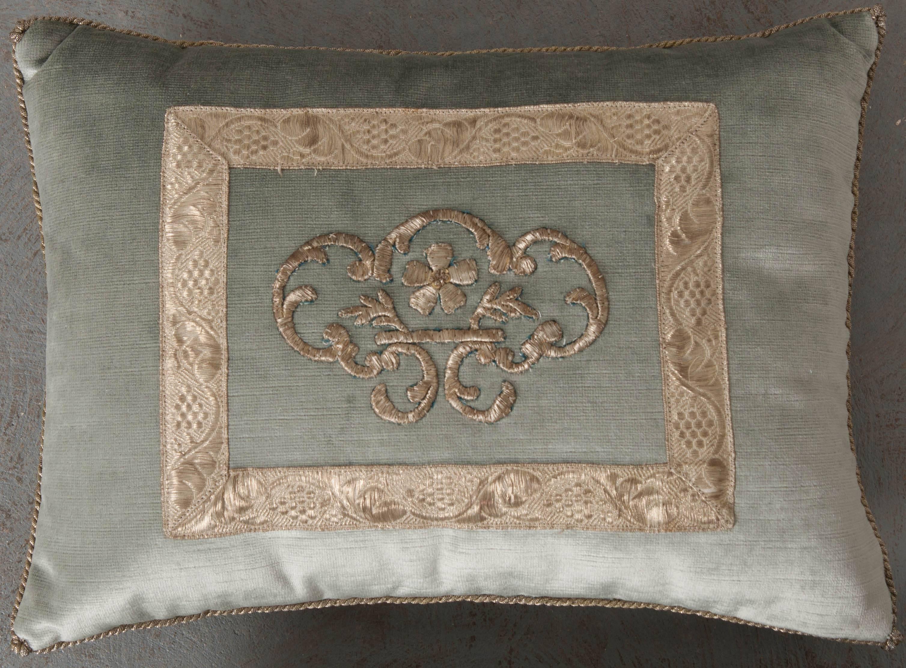 Antique Ottoman Empire raised silver metallic embroidery, framed with antique silver metallic galon on pale French blue velvet. Hand-trimmed with vintage silver metallic cording. Knotted in the corners. Available for individual purchase: $835.00
