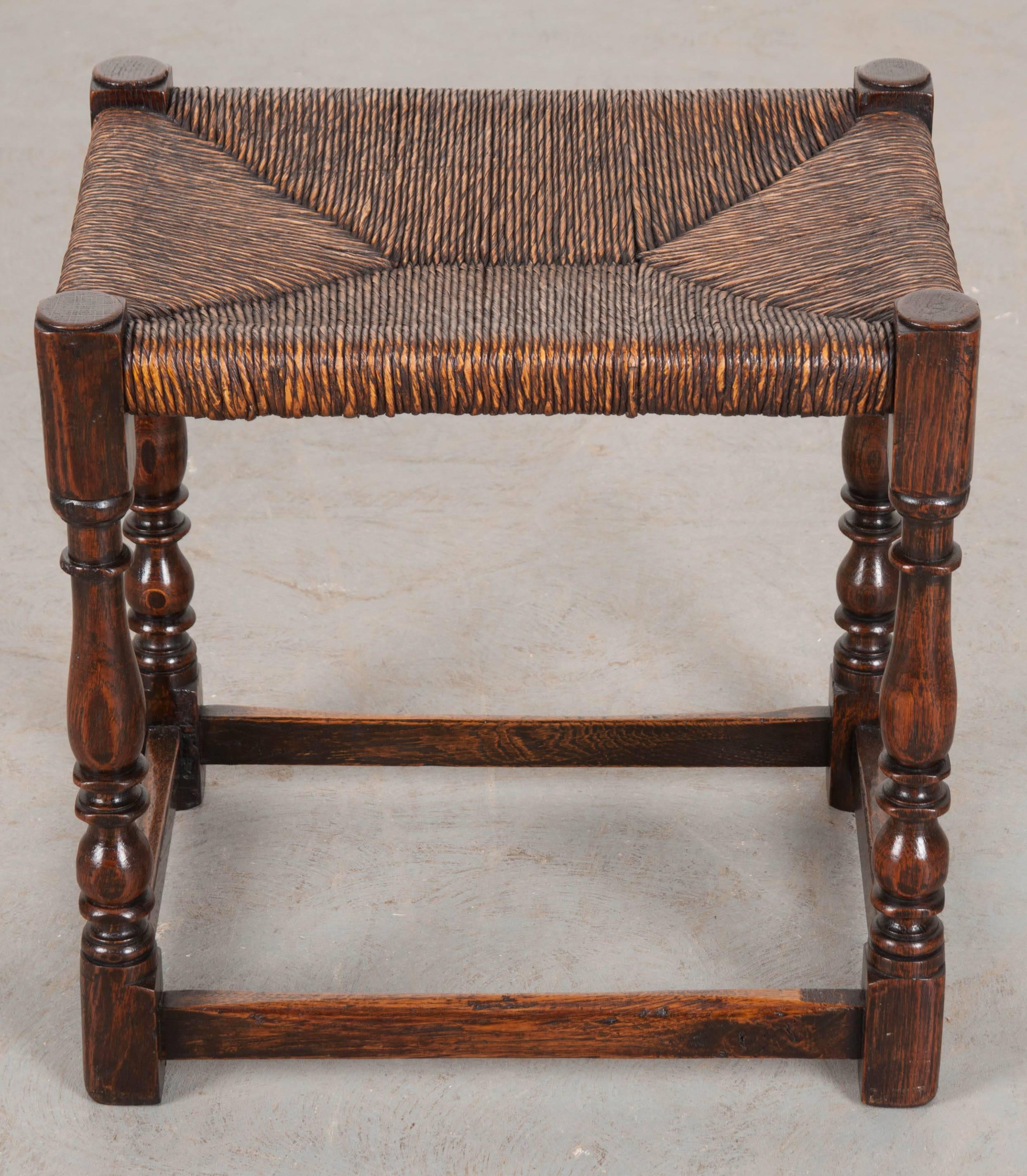 This excellent little stool comes from England and was made towards the end of the 19th century. The rush seat is in exceptionally wonderful condition given its age and somewhat delicate nature. The four upright supports have all been expertly