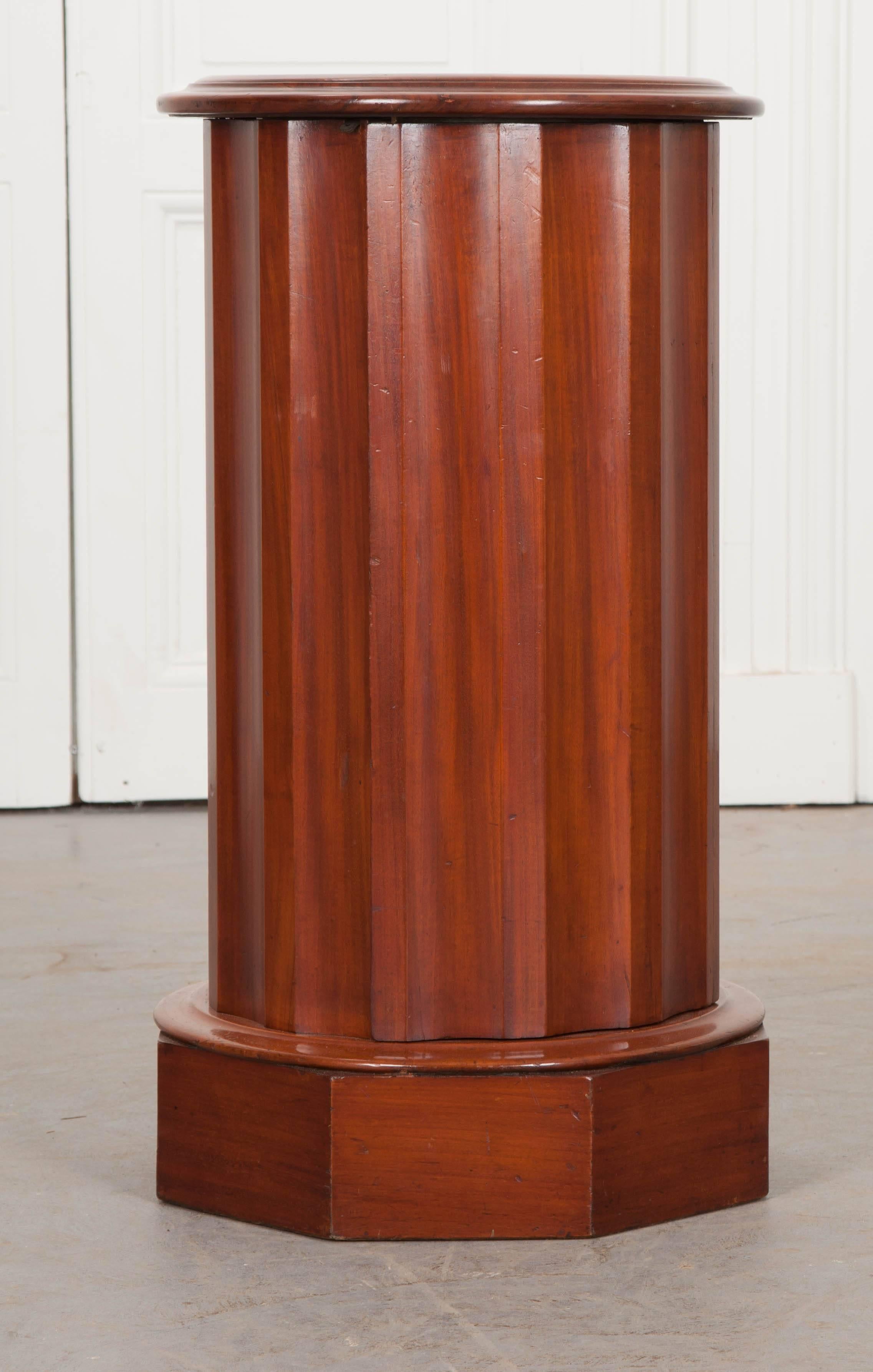 This noble little pedestal cabinet was made using exquisite mahogany in France, towards the mid-19th century. The circular top has a round piece of marble, inset, that is in wonderful antique condition. The pedestal has a discreetly designed