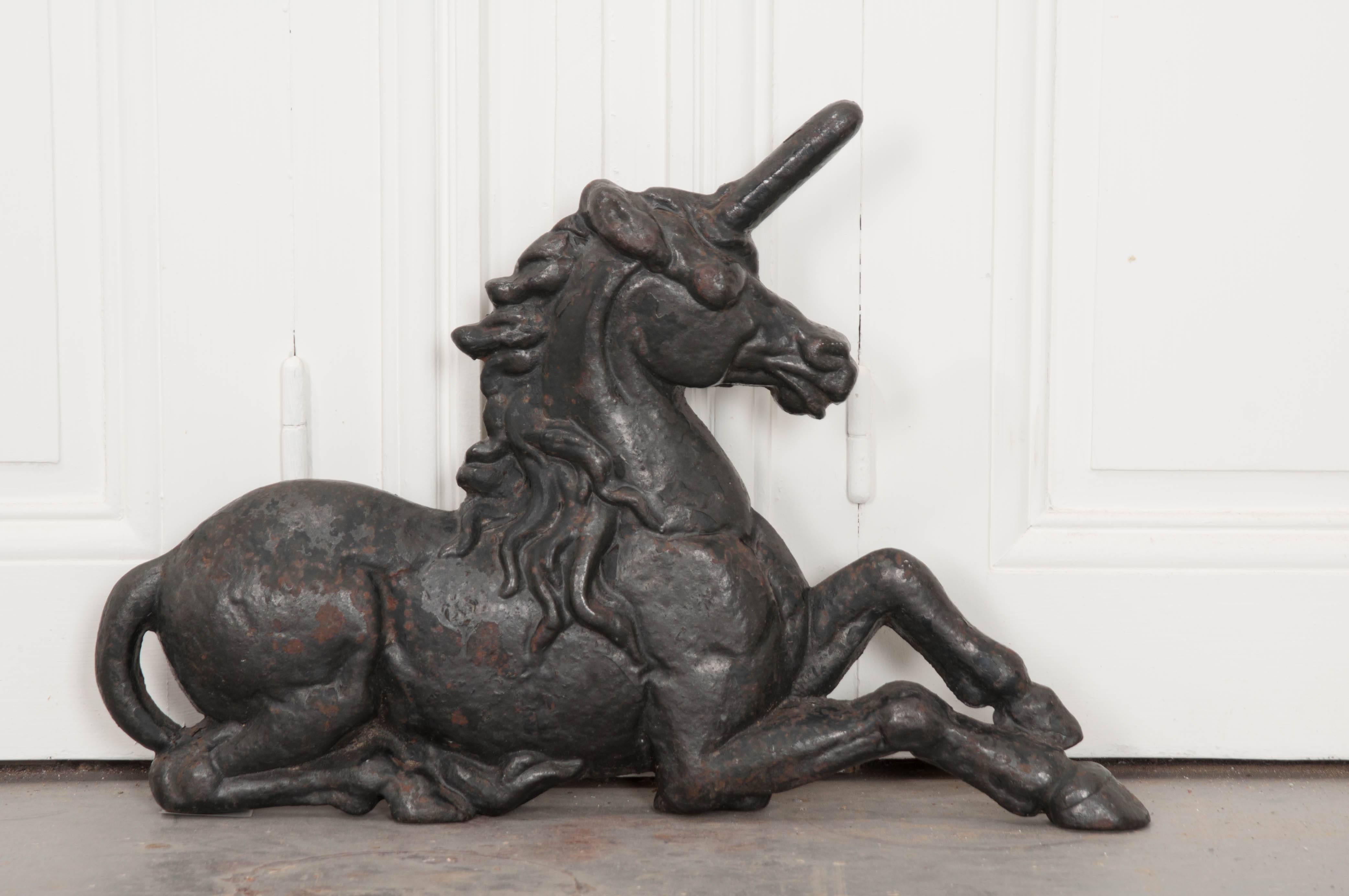 A large, cast iron unicorn, from 19th century England. Unicorns are a common motif used in British and Scottish works. A free unicorn, according to legend, is considered to be a wild and dangerous creature. This unicorn is tame, harmless and eager