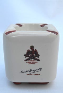 Earthenware advertising ashtray – Léopold Brugerolle Cognac Napoléon Aigle rouge