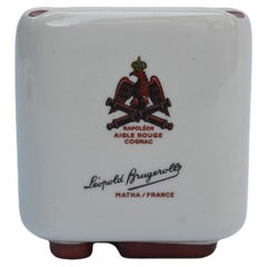 Earthenware advertising ashtray – Léopold Brugerolle Cognac Napoléon Aigle rouge