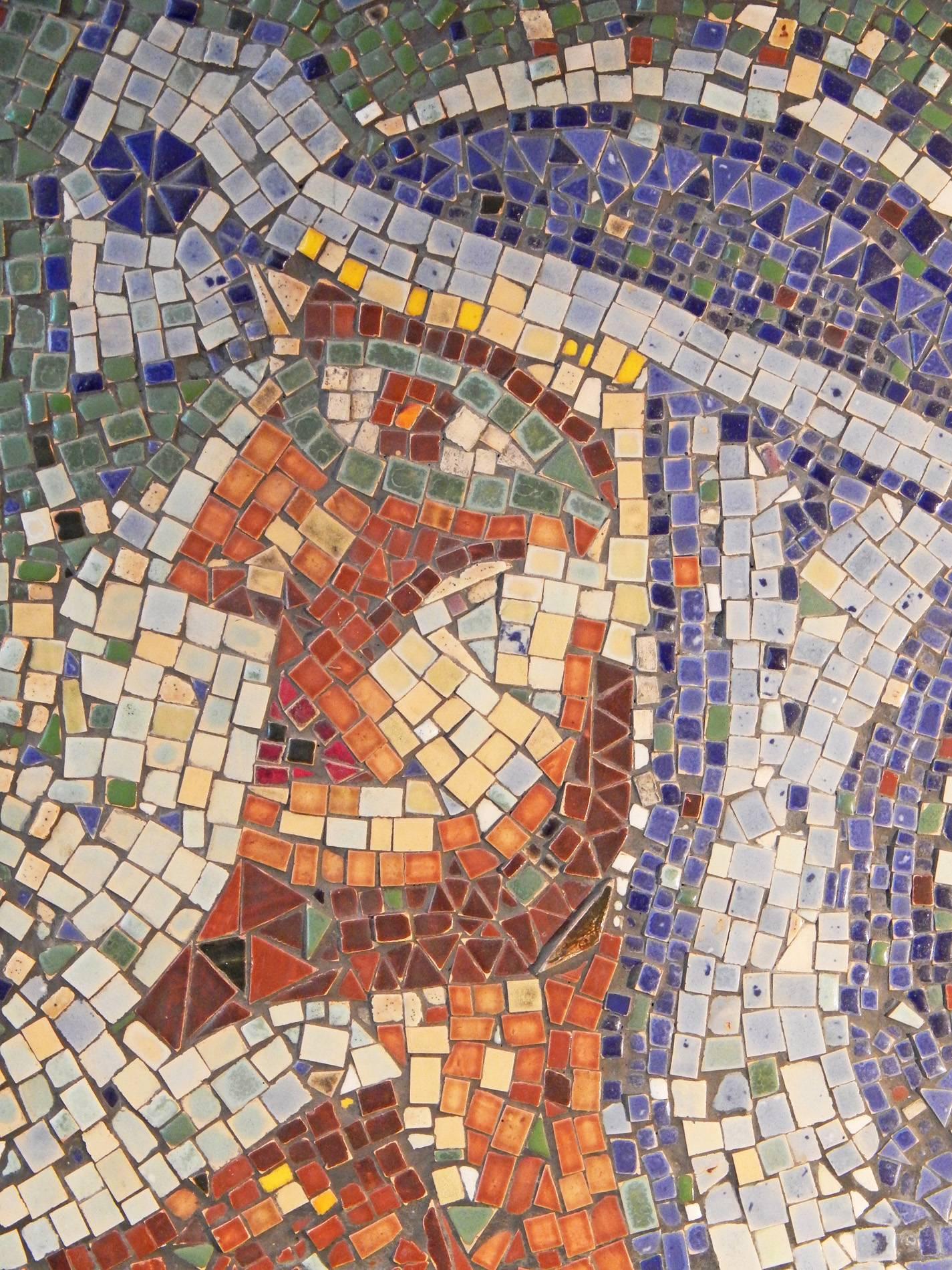 Made up of a rich variety of color-drenched ceramic tesserae, this unique mosaic panel depicts a bearded Egyptian head in profile, his headdress vivid in tones of periwinkle and purple, his face ruddy in hues of burnt sienna, deep red and earth.