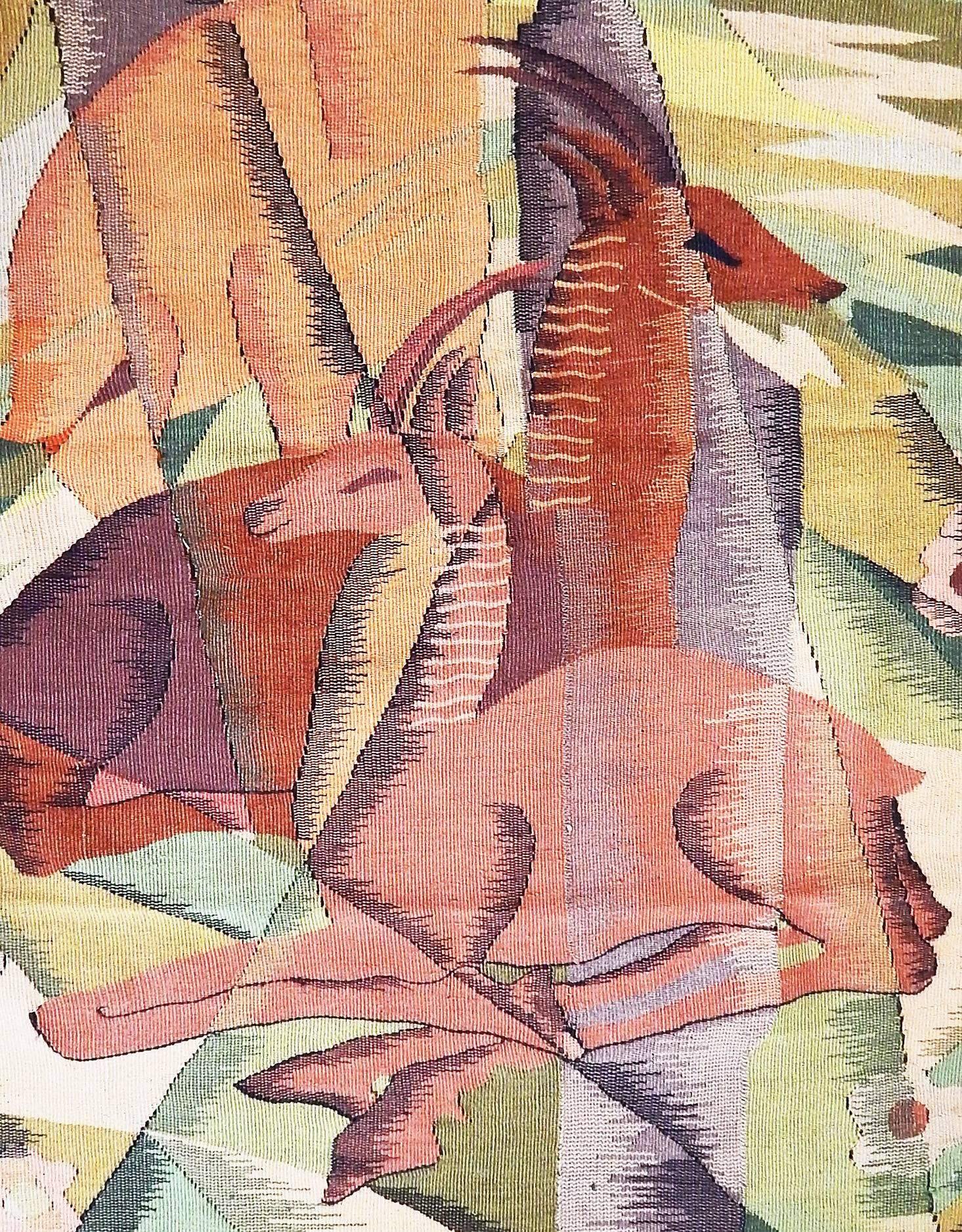 Brilliantly occupying the fabled place where Art Deco stylization and Cubist fragmentation meet, this tapestry brilliantly captures a trio of mountain goats -- in gorgeous shades of camel, burnt sienna and dusty marble -- in a fractured, mountainous