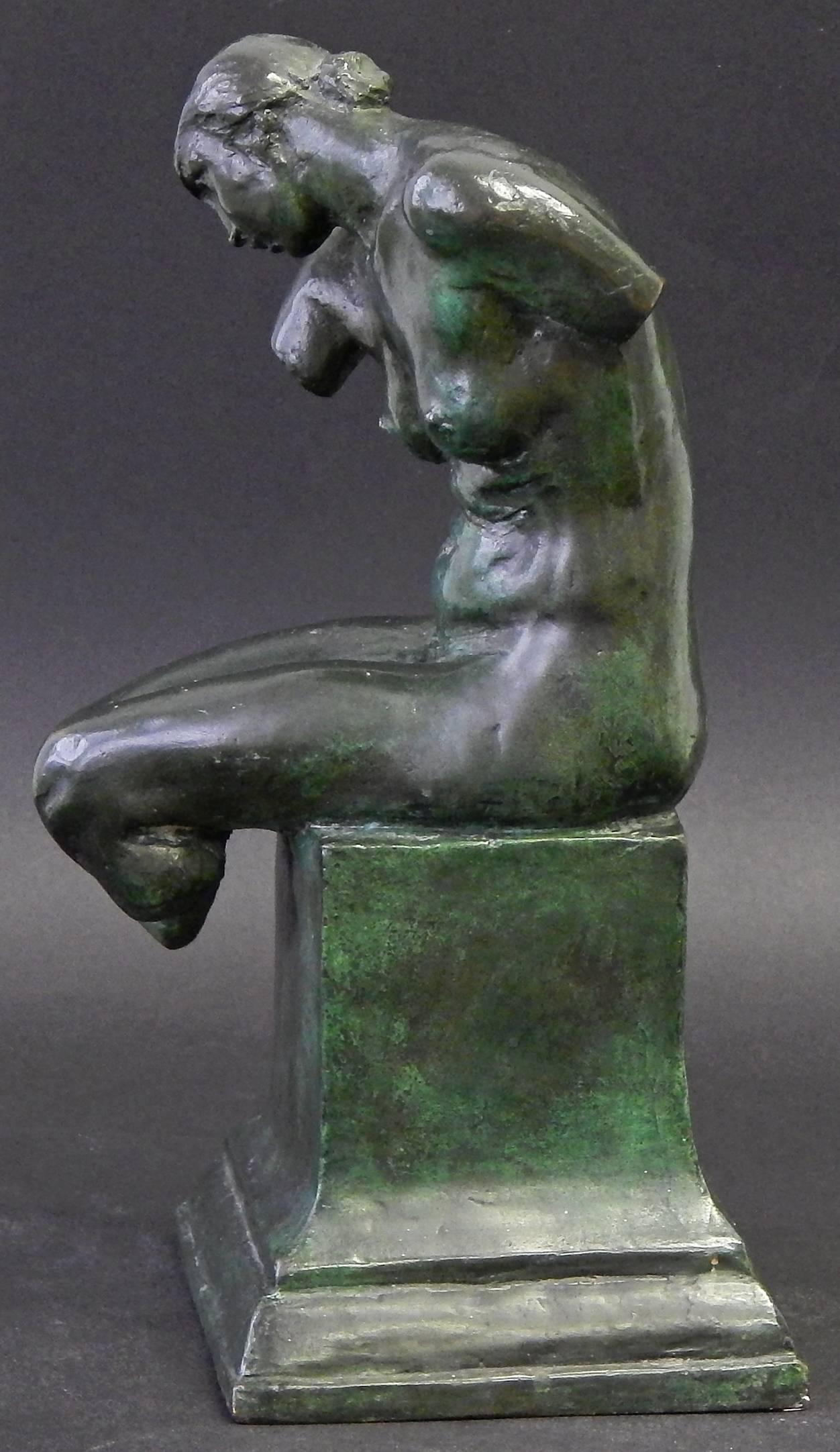 Finished with a gorgeous, deep green-black patina with mossy highlights, this rare pair of bronze bookends depicting seated female nudes was sculpted by Max Kalish, best known for his series of sculptures celebrating the American worker. By