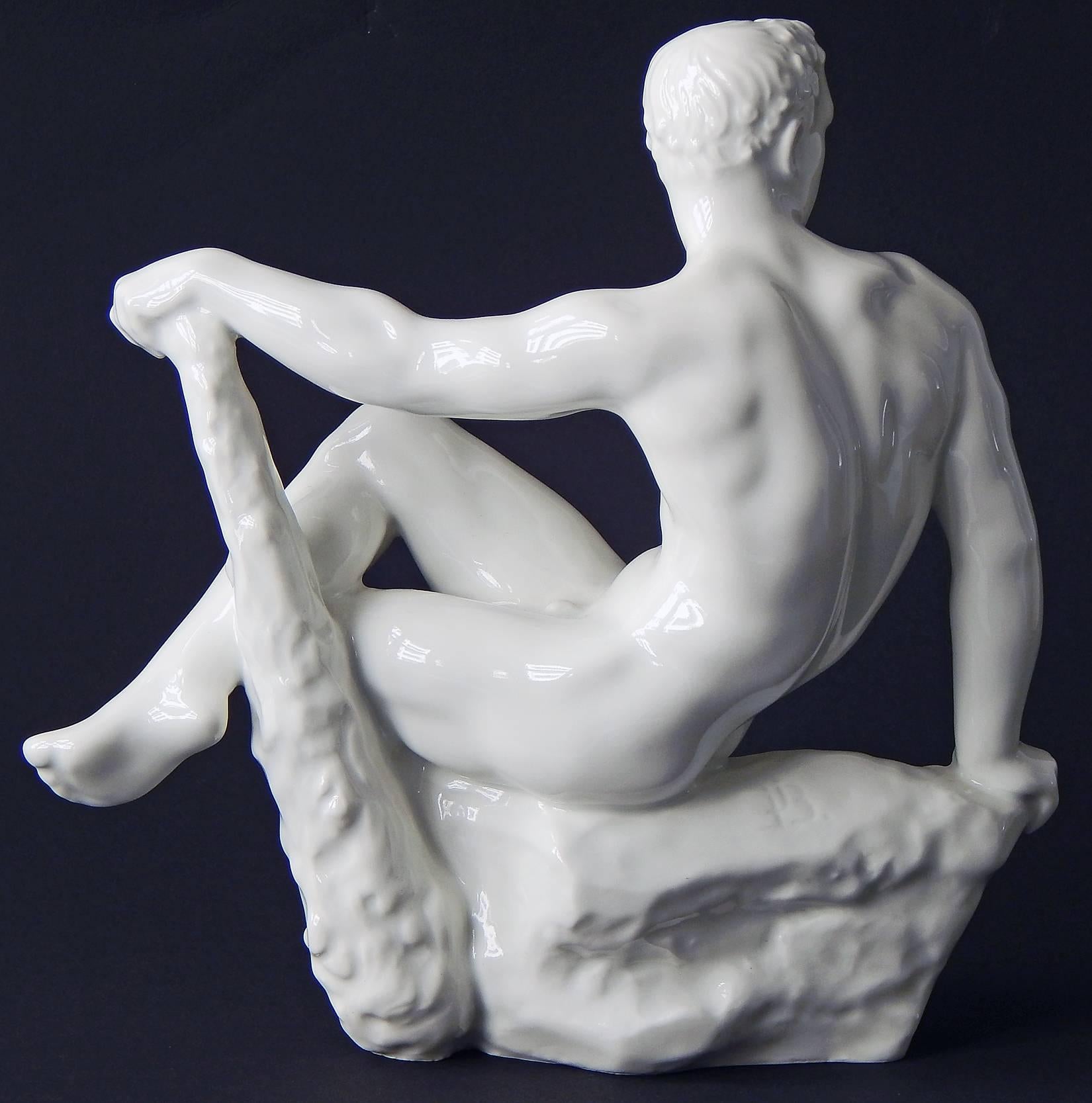 Uncontestably, one of the most sensuous pieces of figural porcelain of the 20th century, this piece shows Hercules resting on a rocky promontory, with one arm outstretched and resting on his signature club. Although it was sculpted by Jens Jakob