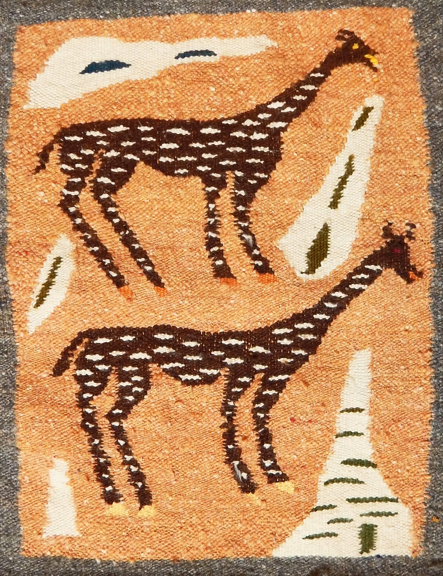 Perhaps inspired by the renewal of ancient weaving traditions undertaken by the Ramses Wissa Wassef workshop in Egypt, among others in North Africa, this marvelous Mid-Century tapestry in nubby wool depicts a variety of flora and fauna from the