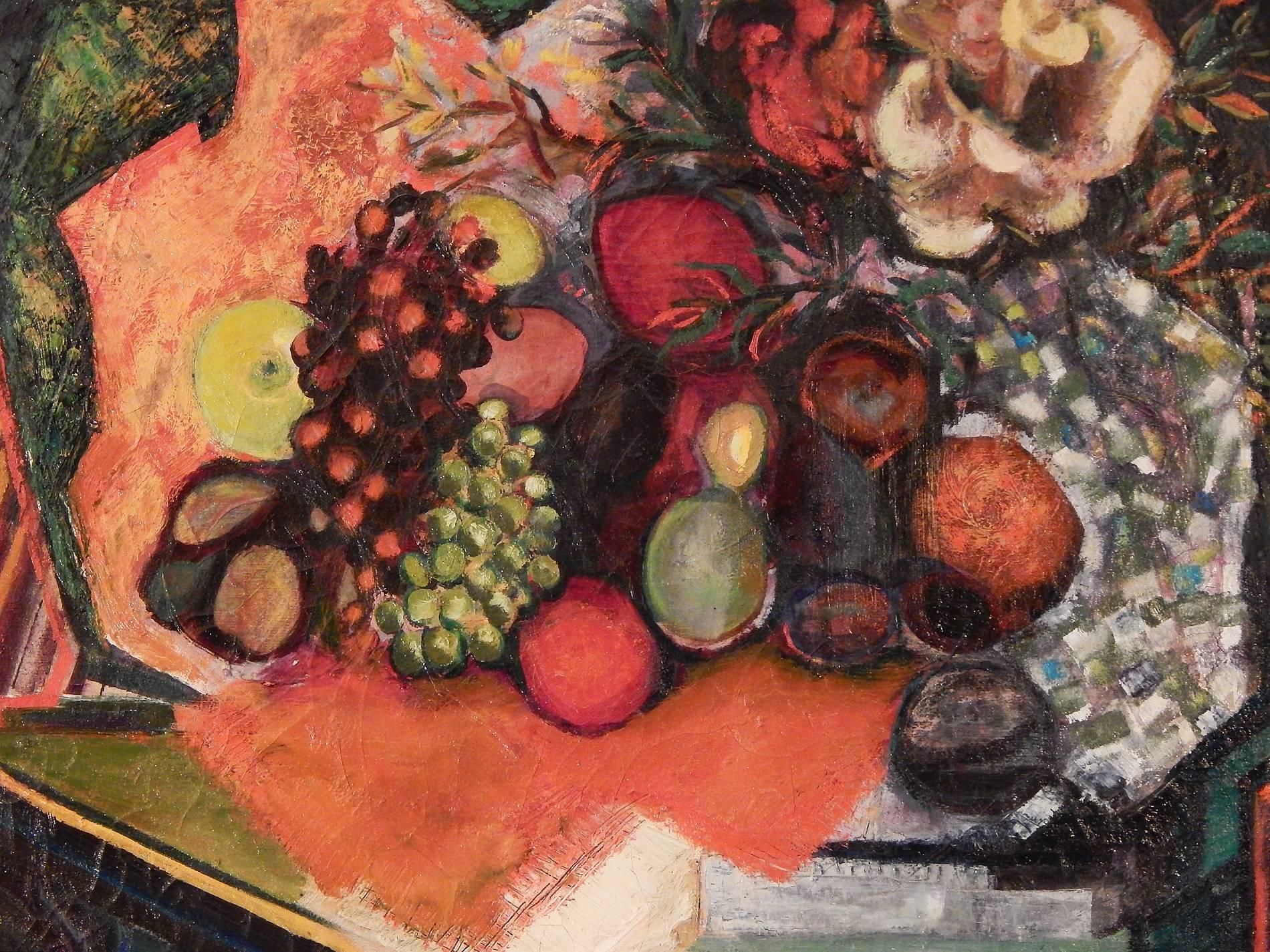 A brilliant example of American Cubism, this vividly-hued still life depicts an autumnal array of fruit, green and red grapes, lemons, figs and persimmons, on a table with a blue-and-green checked cloth. The palette of oranges, greens and blues is