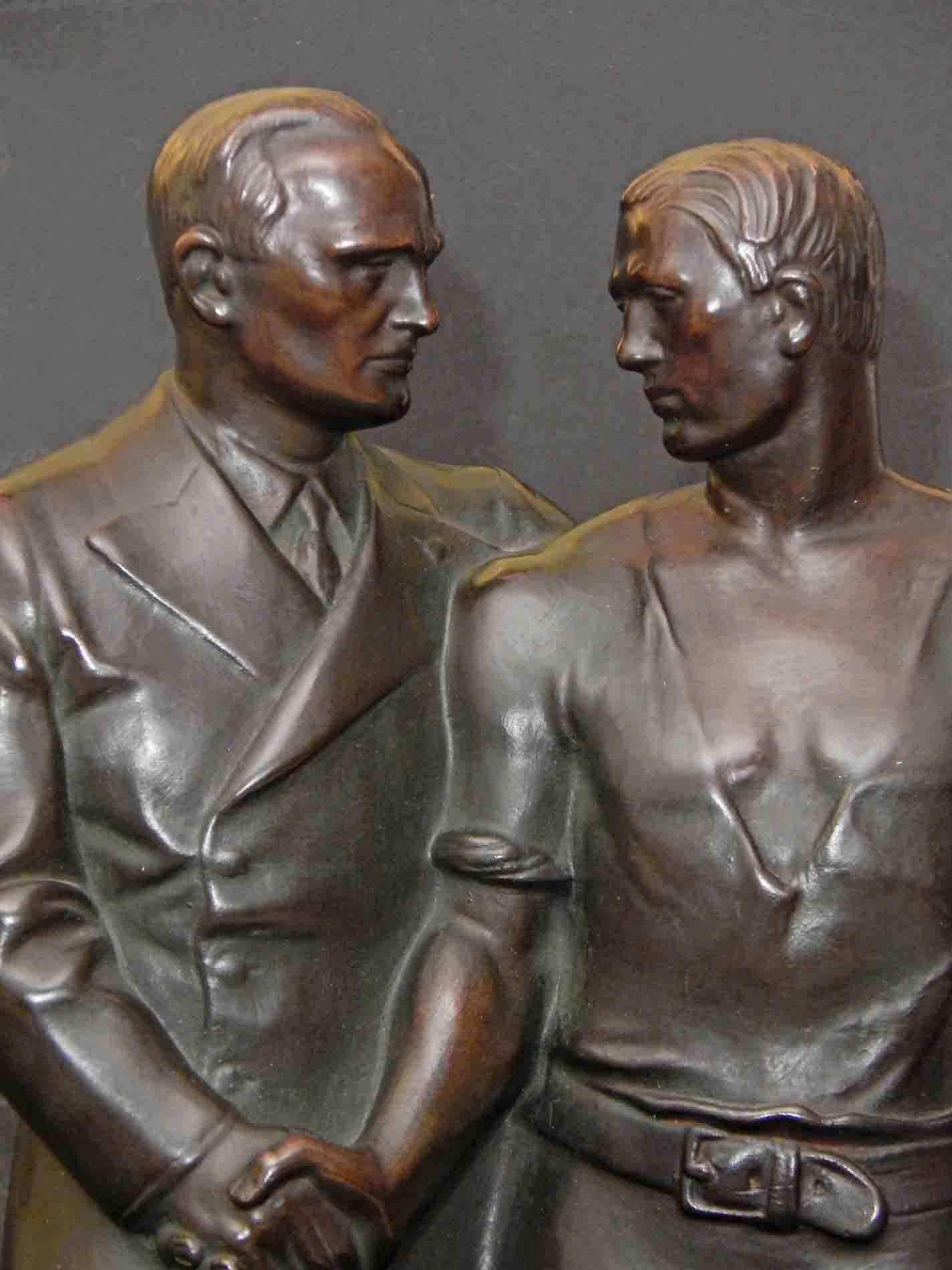 An extremely rare and very fine bronze sculpture depicting stylized figures of labour and management shaking hands, looking calmly and peaceably into each other's eyes, this piece was sculpted by Hendrik Scholter, a Dutch sculptor. Very few casts of