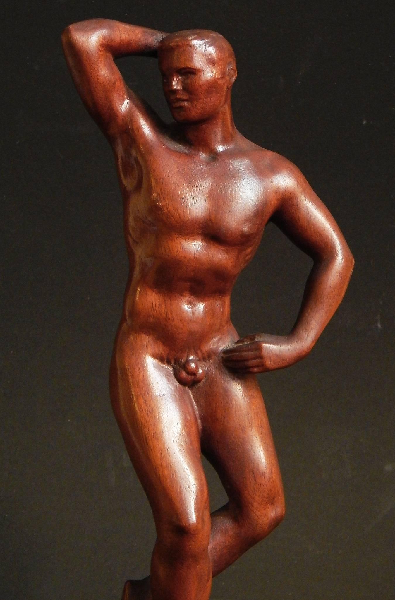 Beautifully sculpted from a ruddy block of mahogany and finished with a patina that gives it a lovely glow, this piece is a superb example of WPA-era sculpture. The artist, Raymond Turner, was a native of the Midwest who later won fame in New York,