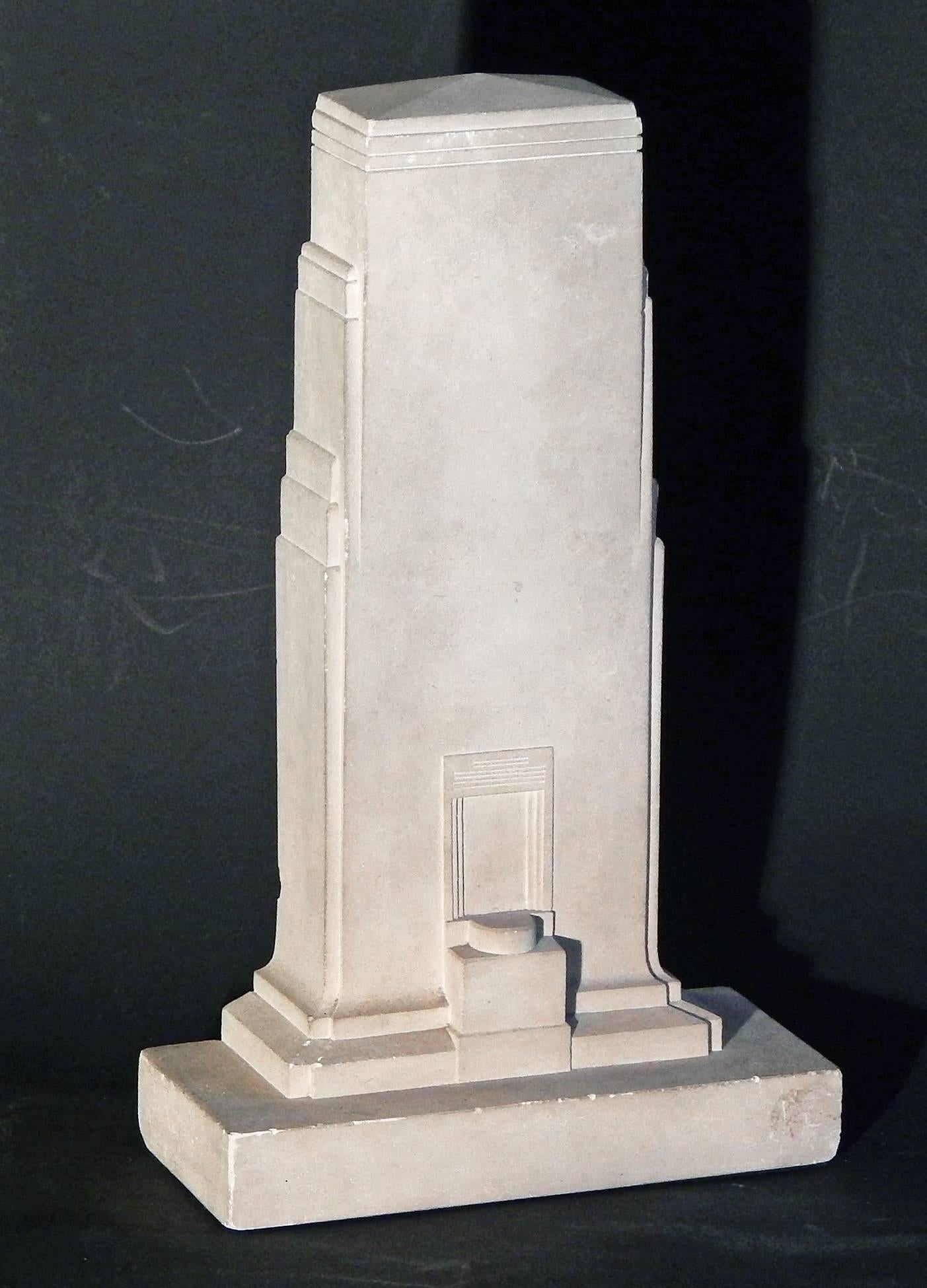 Remarkable and unique, this garniture set of three carved limestone pieces -- a centerpiece flanked by two candlesticks, is a stunning example of high style Art Deco sculpture. The centerpiece is clearly inspired by Art Deco skyscrapers and
