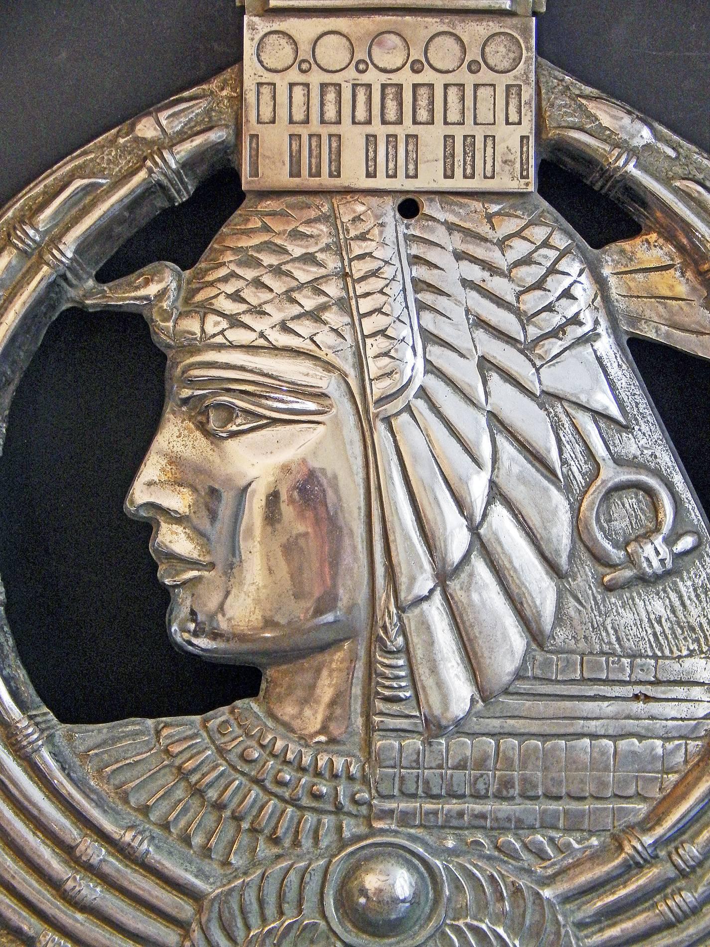 Fabulous, stunning and probably unique, this nickeled bronze bas relief sculpture was created for the Land Bank of Egypt's office in Paris in the late 1920s, capturing the logo of the bank in three dimensions. At the center of the cartouche is a
