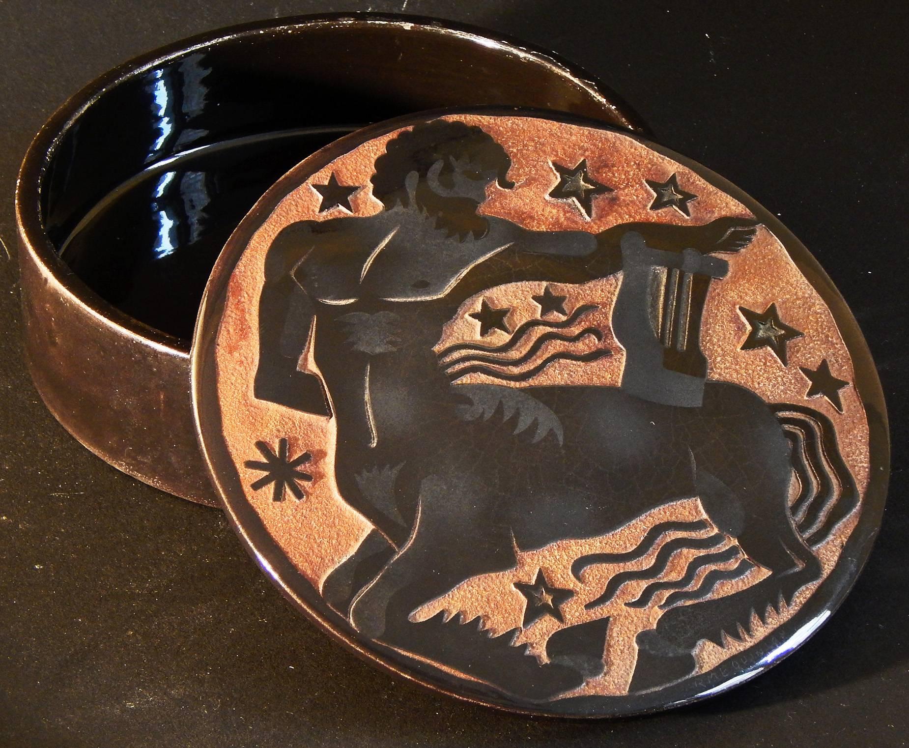 Striking and beautifully crafted, this ceramic, bas relief box depicts a centaur holding a harp, with a series of stars overhead no doubt symbolizing the Zodiac sign of Sagittarius. The artist, Roger Mequinion, was one of the first sculptors to work
