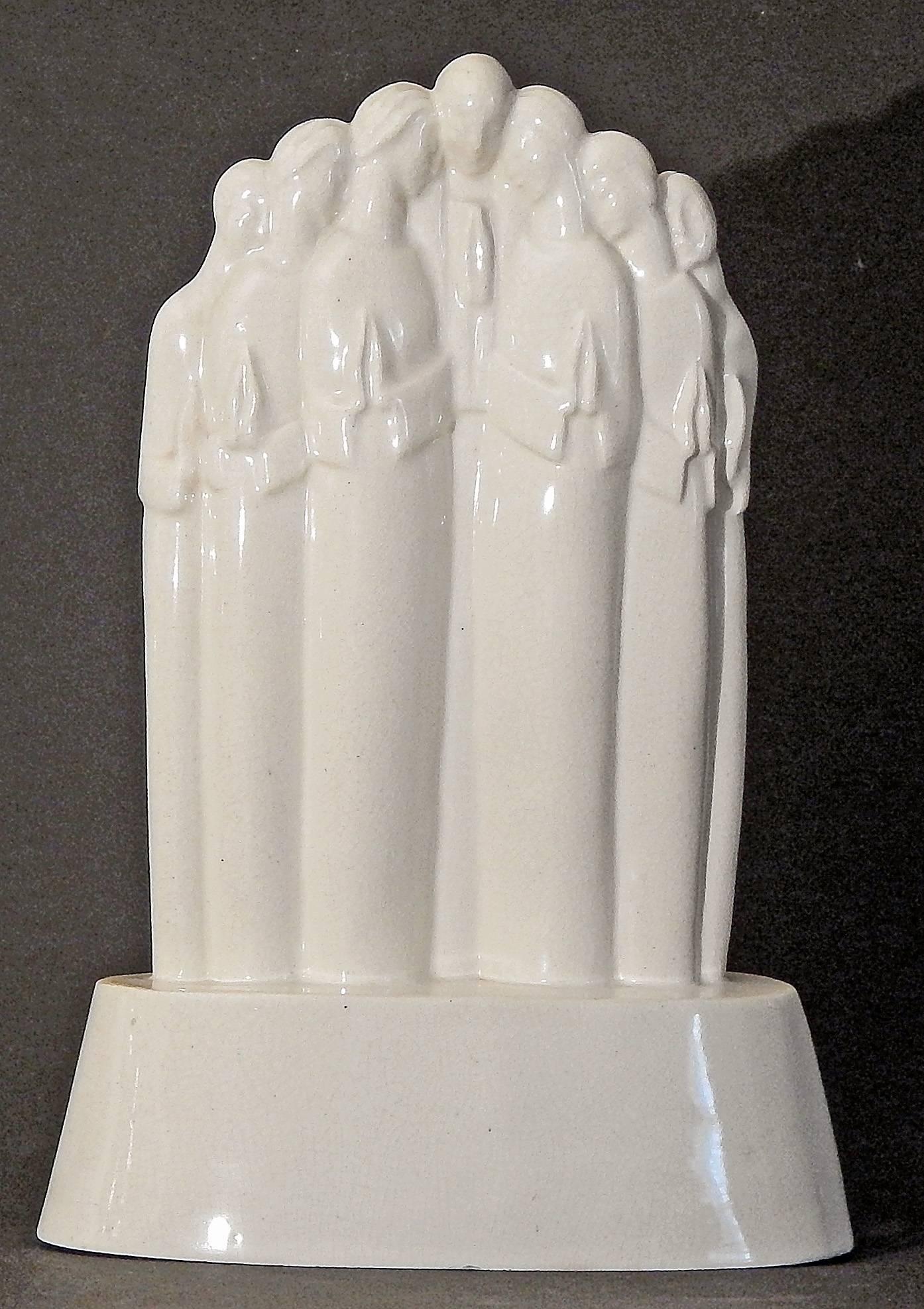One of the rarest and most important sculptures eminating from the ARKO ceramic school established by Alexander Archipenko in Woodstock, New York, this stylized group of praying figures was created by Lu Duble. Archipenko studied in Kiev and Paris