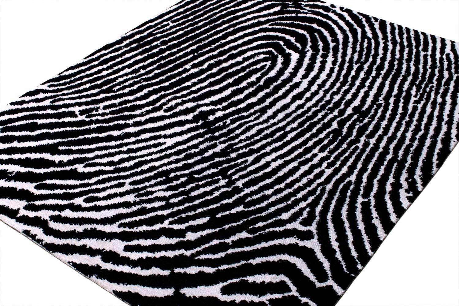 Thumbprint is handwoven with highland wool and high grade silk. Our 'thumbprint' design can be custom-made to match any fingerprint for a complete personal experience! Shown here in a Classic graphic colorway of black and white, this is an original