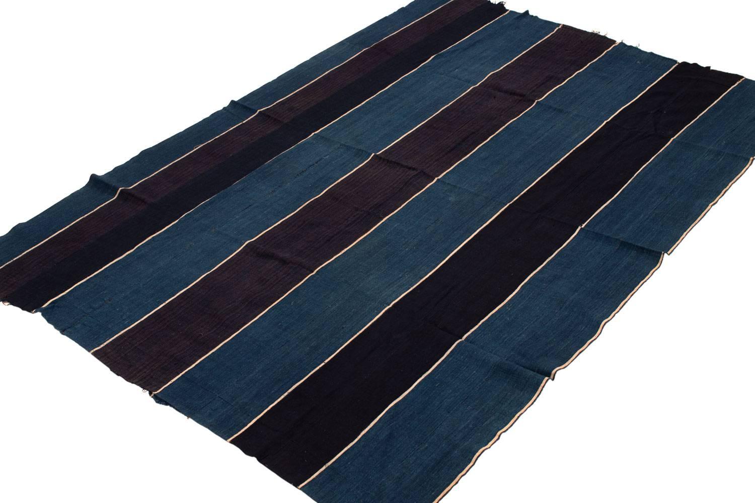 This is an old prestigious wrap from the Yoruba Tribe of Nigeria. Made with superb indigo dye and native hand-spun cotton, it was owned by wealthy person of that tribe and probably only worn on special occasions. It has a strong, tight weave of very