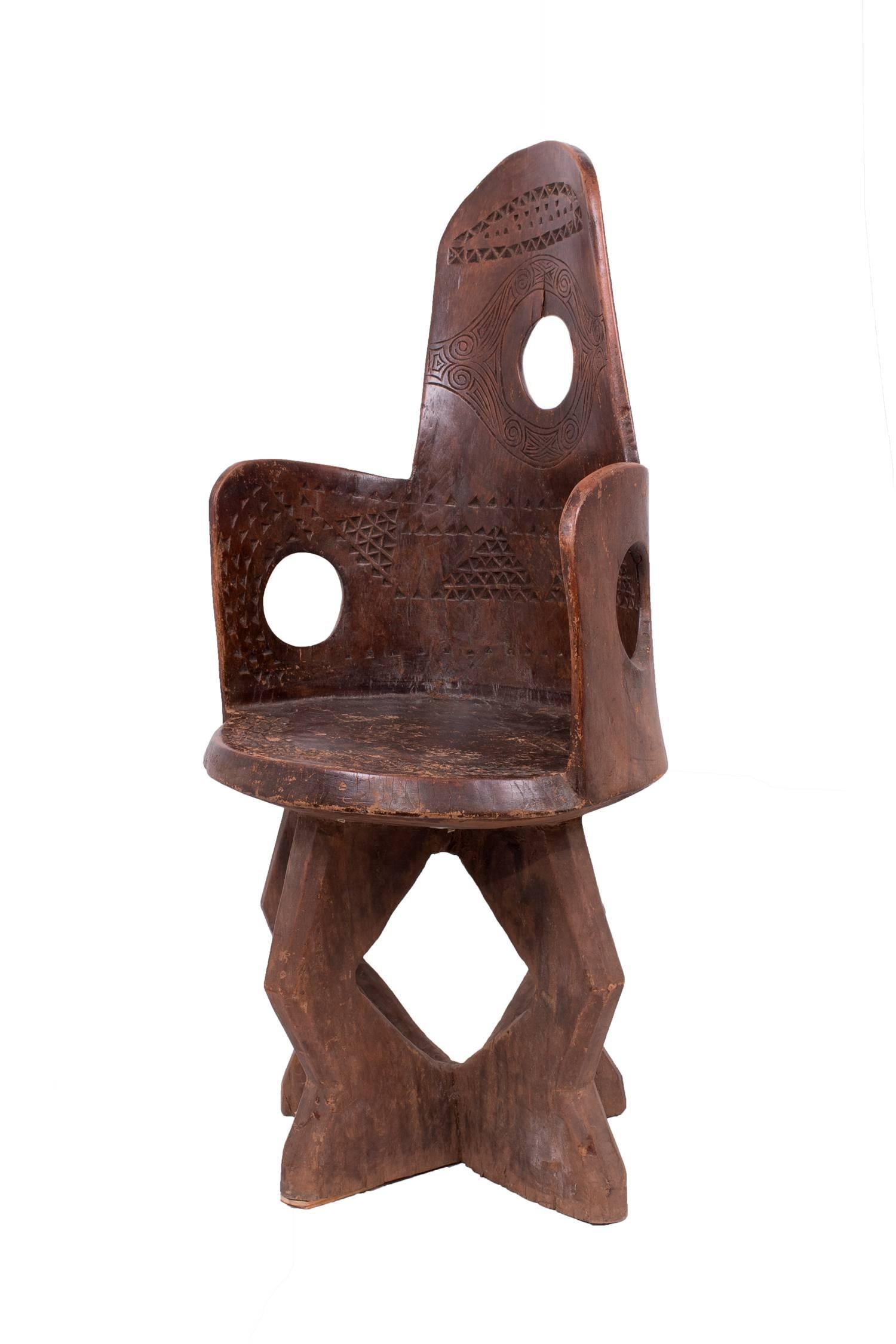 Carved from a single piece of dense, heavy wood with wonderful motifs.