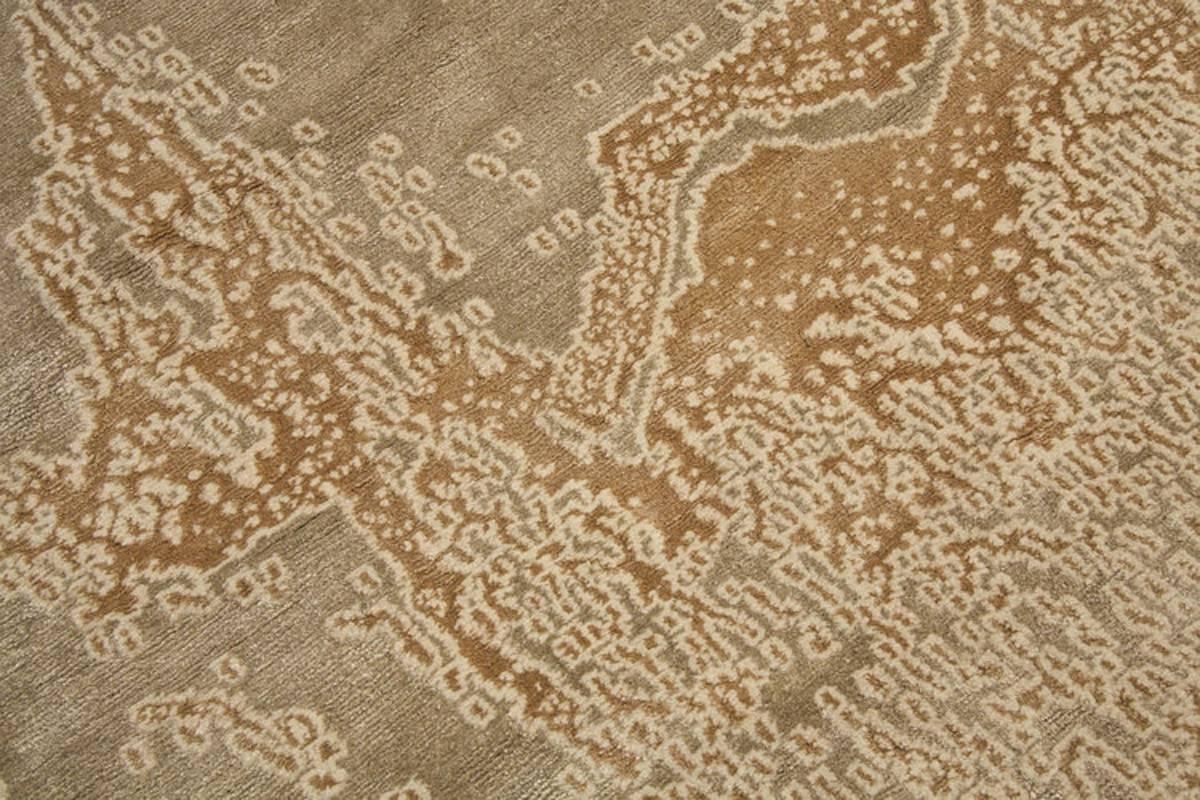 Designed using warm, earthy colors and woven with handspun wild silk, this carpet has a zen feeling. The Abstract design is a signature look by Carini. 