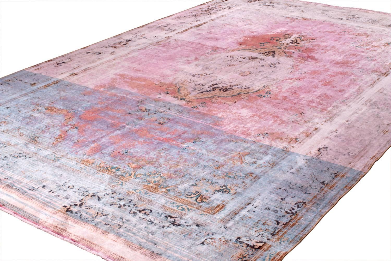 This beautiful carpet is handwoven and artfully sheared down to create a dreamy pastel pink art rug. Measures: 9' x 14'. Handmade in Afghanistan out of hand spun Afghan wool. It was designed to look distressed and worn but it is brand new. 

 Joseph