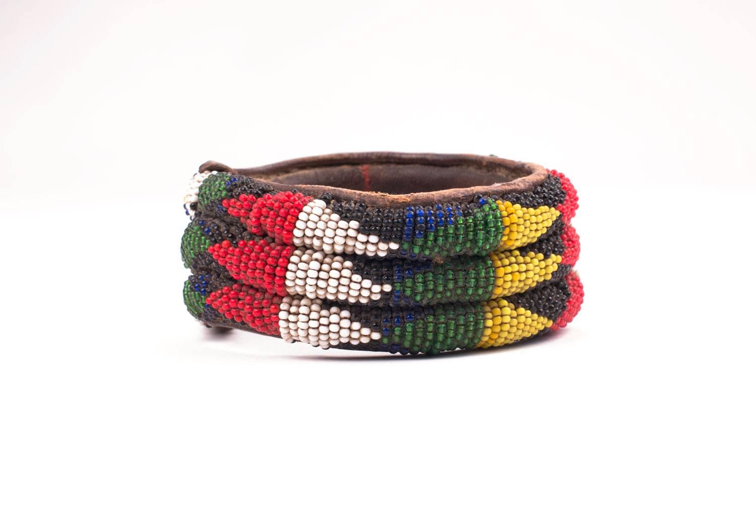 An African Yoruba tribal bracelet made of hand-stitched leather and hand-sewn beadwork. Dating from the 1980s these older bracelets are of much better quality then later ones. The beads are very carefully sewn on and the piece is strong.