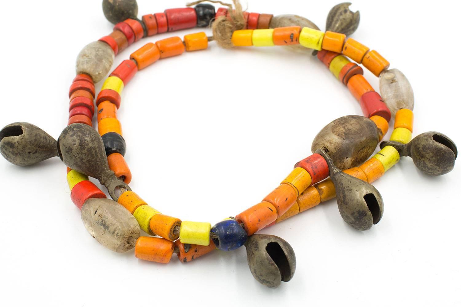 A wonderful old necklace from the Naga tribe . Made from old glass trade beads and hand-wrought brass bells, this necklace is an authentic piece of tribal jewelry.