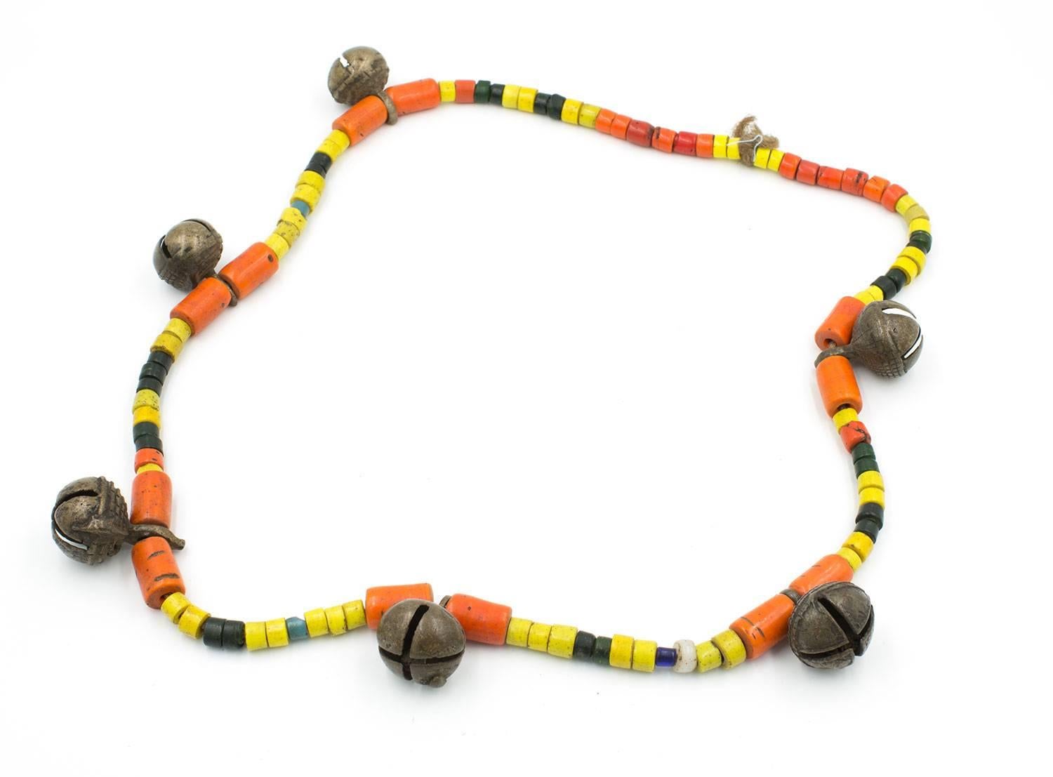 The beads and bronze bells on this necklace are old and have great patina. This is an authentic tribal necklace from the Naga tribe.